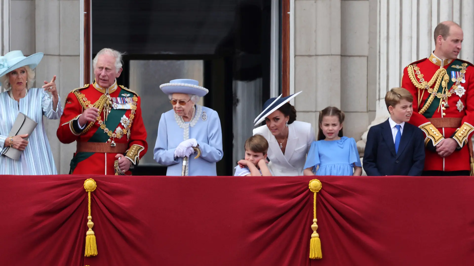 From left, Camilla, Duchess of Cornwall, Britain's Prince Charles, Queen Elizabeth II, Prince Louis, Kate, Duchess of Cambridge, Princess Charlotte, Prince Louis and Prince William watch the Trooping of the Color in London, Thursday June 2, 2022, on the first of four days of celebrations to mark the Platinum Jubilee. The events over a long holiday weekend in the U.K. are meant to celebrate the monarch’s 70 years of service. (Richard Pohle, Pool Photo via AP)