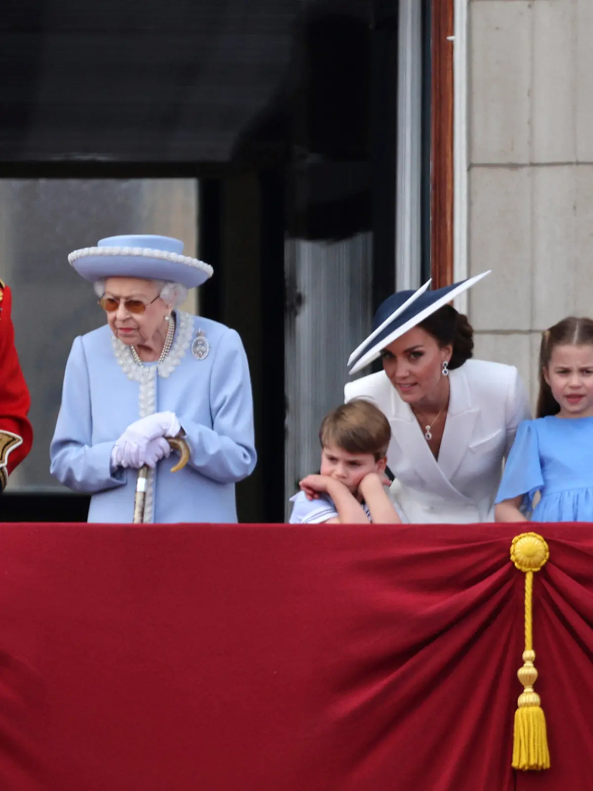From left, Camilla, Duchess of Cornwall, Britain's Prince Charles, Queen Elizabeth II, Prince Louis, Kate, Duchess of Cambridge, Princess Charlotte, Prince Louis and Prince William watch the Trooping of the Color in London, Thursday June 2, 2022, on the first of four days of celebrations to mark the Platinum Jubilee. The events over a long holiday weekend in the U.K. are meant to celebrate the monarch’s 70 years of service. (Richard Pohle, Pool Photo via AP)