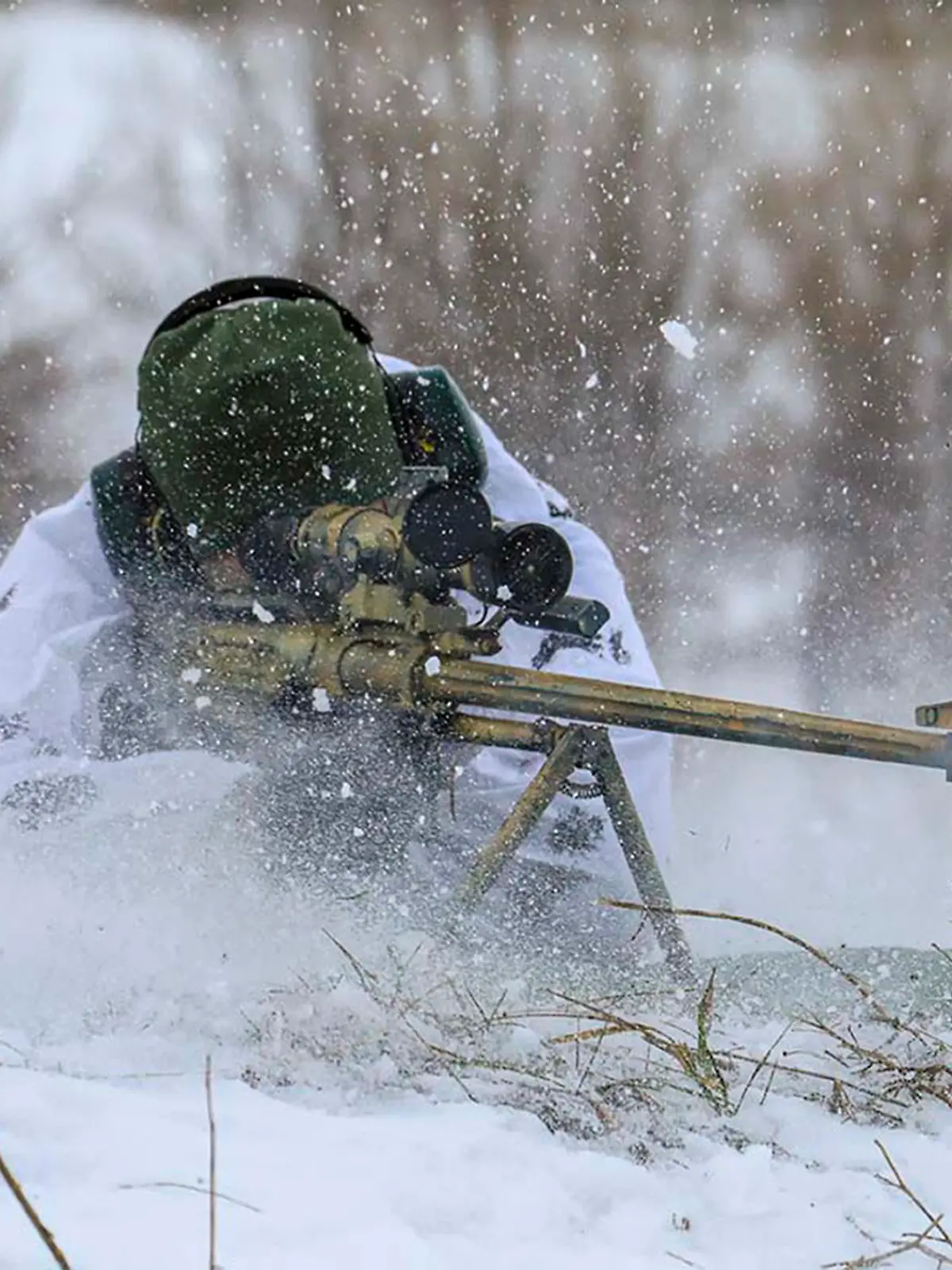 In this photo released by the Russian Defense Ministry Press Service on Tuesday, Feb. 1, 2022, A sniper fires during a military exercise in the Nizhny Novgorod Region, Russia. (Russian Defense Ministry Press Service via AP)