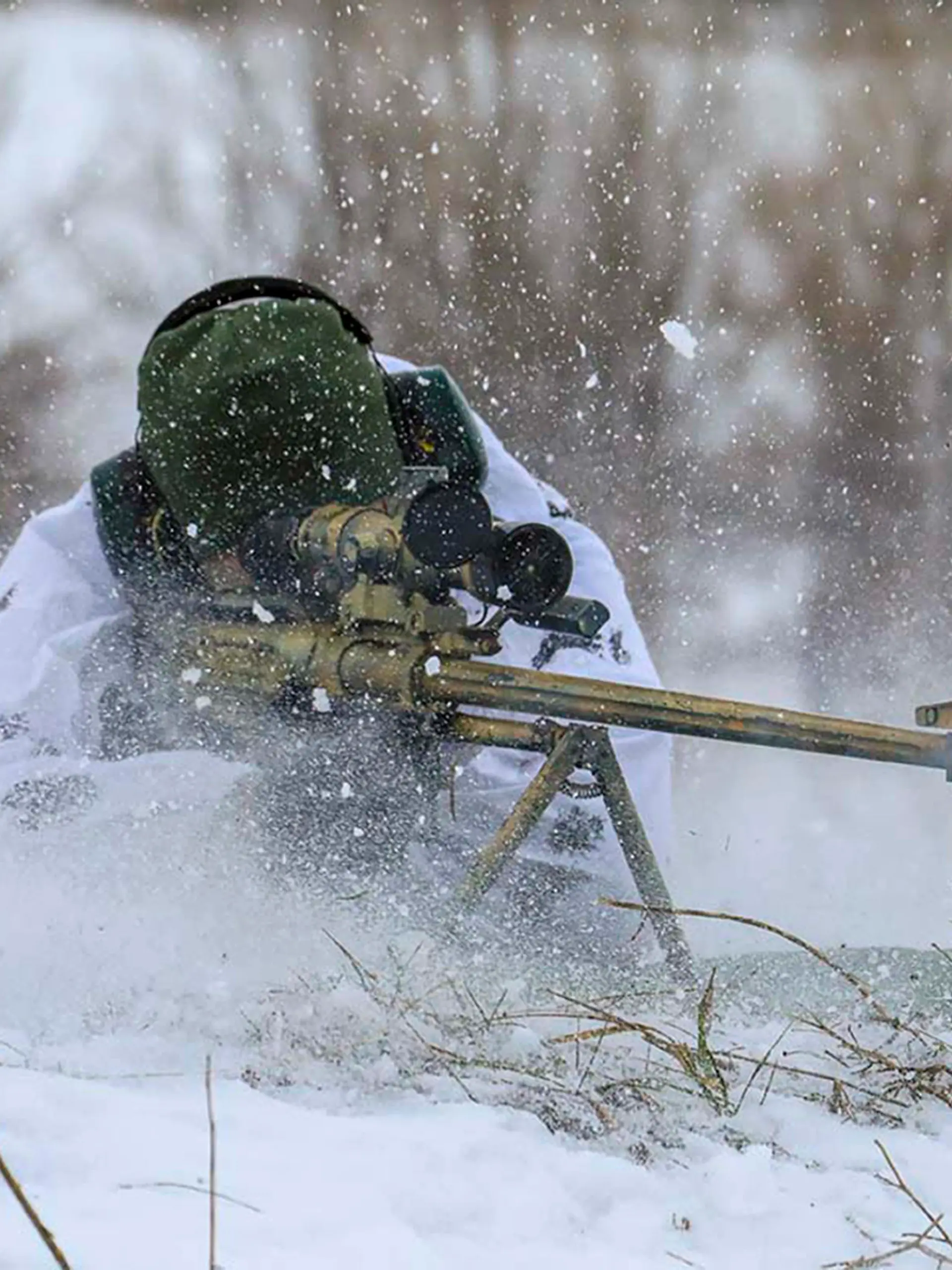 In this photo released by the Russian Defense Ministry Press Service on Tuesday, Feb. 1, 2022, A sniper fires during a military exercise in the Nizhny Novgorod Region, Russia. (Russian Defense Ministry Press Service via AP)