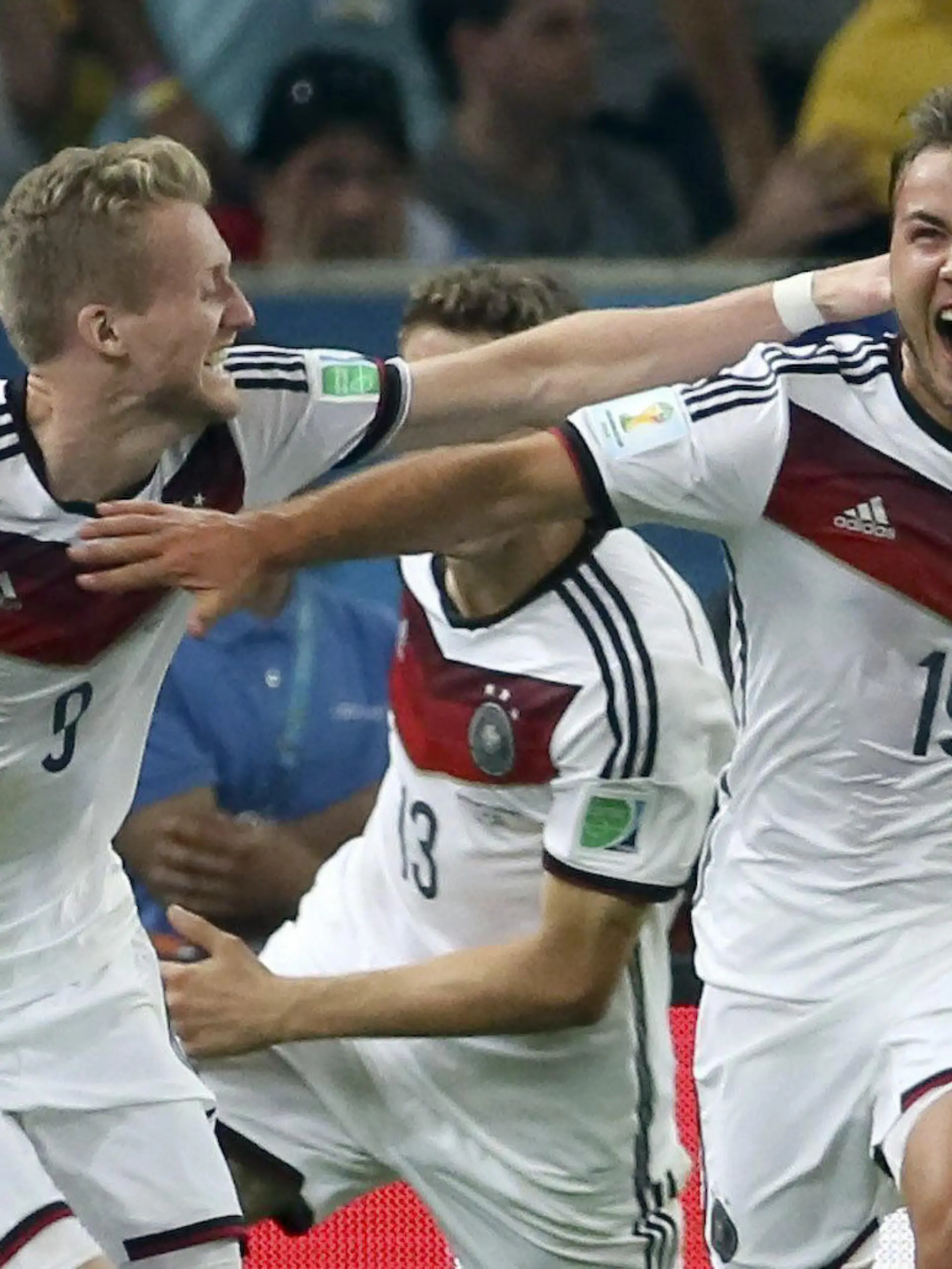 FILE - epa04314829 Mario Goetze (R) of Germany is celebrated by Andre Schuerrle (L) after scoring the winning goal during the FIFA World Cup 2014 final between Germany and Argentina at the Estadio do Maracana in Rio de Janeiro, Brazil, 13 July 2014. (RESTRICTIONS APPLY: Editorial Use Only, not used in association with any commercial entity - Images must not be used in any form of alert service or push service of any kind including via mobile alert services, downloads to mobile devices or MMS messaging - Images must appear as still images and must not emulate match action video footage - No alteration is made to, and no text or image is superimposed over, any published image which: (a) intentionally obscures or removes a sponsor identification image; or (b) adds or overlays the commercial identification of any third party which is not officially associated with the FIFA World Cup) EPA/Antonio Lacerda EDITORIAL USE ONLY (zu dpa-Meldung: «Nach Götze wechselt auch Schürrle zu Borussia Dortmund» vom 22.07.2016) +++(c) dpa - Bildfunk+++