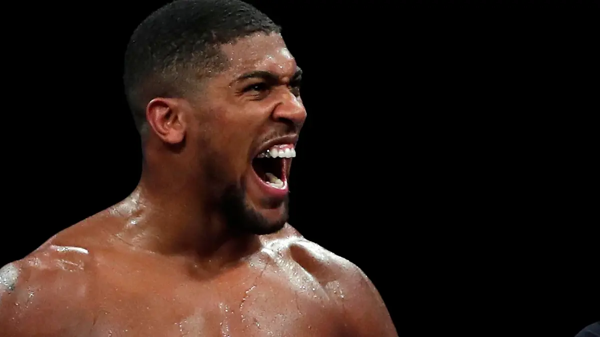 Boxing - Heavyweight World Title Fight - Anthony Joshua v Kubrat Pulev - The SSE Arena, London, Britain - December 12, 2020 Anthony Joshua celebrates winning his fight against Kubrat Pulev Pool via REUTERS/Andrew Couldridge