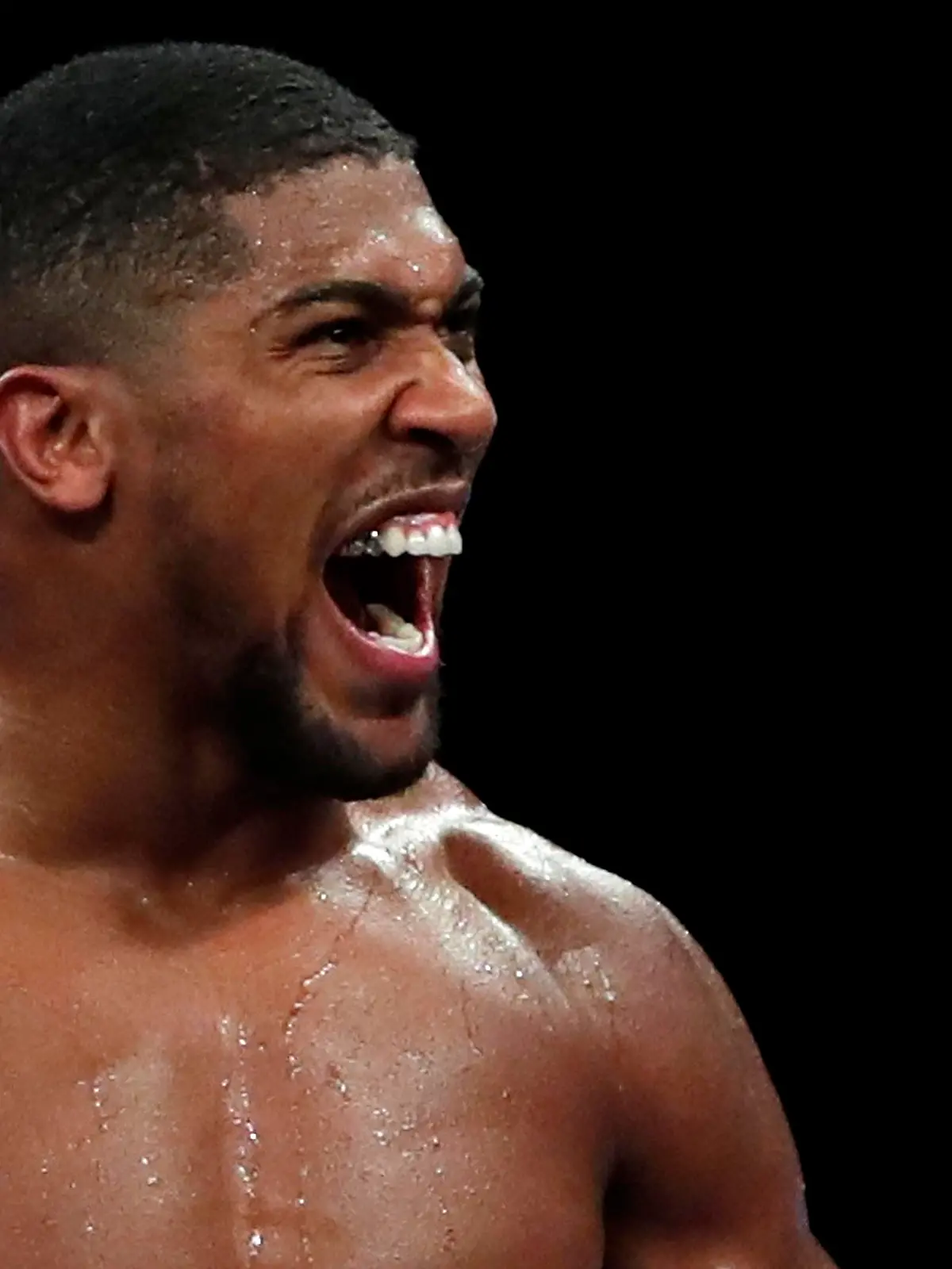 Boxing - Heavyweight World Title Fight - Anthony Joshua v Kubrat Pulev - The SSE Arena, London, Britain - December 12, 2020 Anthony Joshua celebrates winning his fight against Kubrat Pulev Pool via REUTERS/Andrew Couldridge