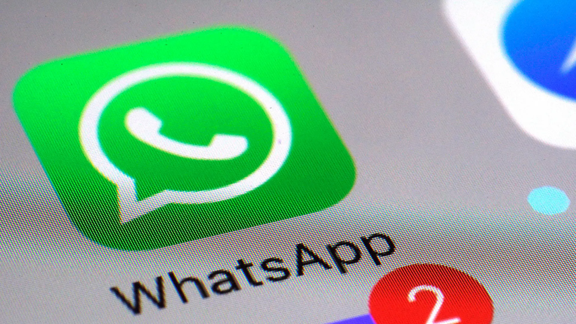 FILE - This March 10, 2017 file photo shows the WhatsApp communications app on a smartphone, in New York. The messaging app WhatsApp has sued the Indian government seeking to defend its users' privacy and stop new rules that would require it to make messages “traceable” to external parties. WhatsApp filed the lawsuit Wednesday, May 26, 2021 in the Delhi High Court, and is arguing that the government rules regarding the traceability of messages are unconstitutional and undermine the fundamental right to privacy. (AP Photo/Patrick Sison, File)