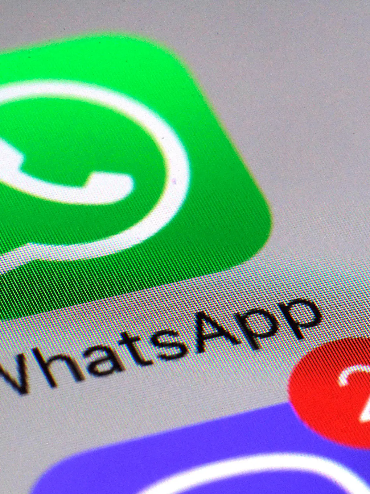 FILE - This March 10, 2017 file photo shows the WhatsApp communications app on a smartphone, in New York. The messaging app WhatsApp has sued the Indian government seeking to defend its users' privacy and stop new rules that would require it to make messages “traceable” to external parties. WhatsApp filed the lawsuit Wednesday, May 26, 2021 in the Delhi High Court, and is arguing that the government rules regarding the traceability of messages are unconstitutional and undermine the fundamental right to privacy. (AP Photo/Patrick Sison, File)