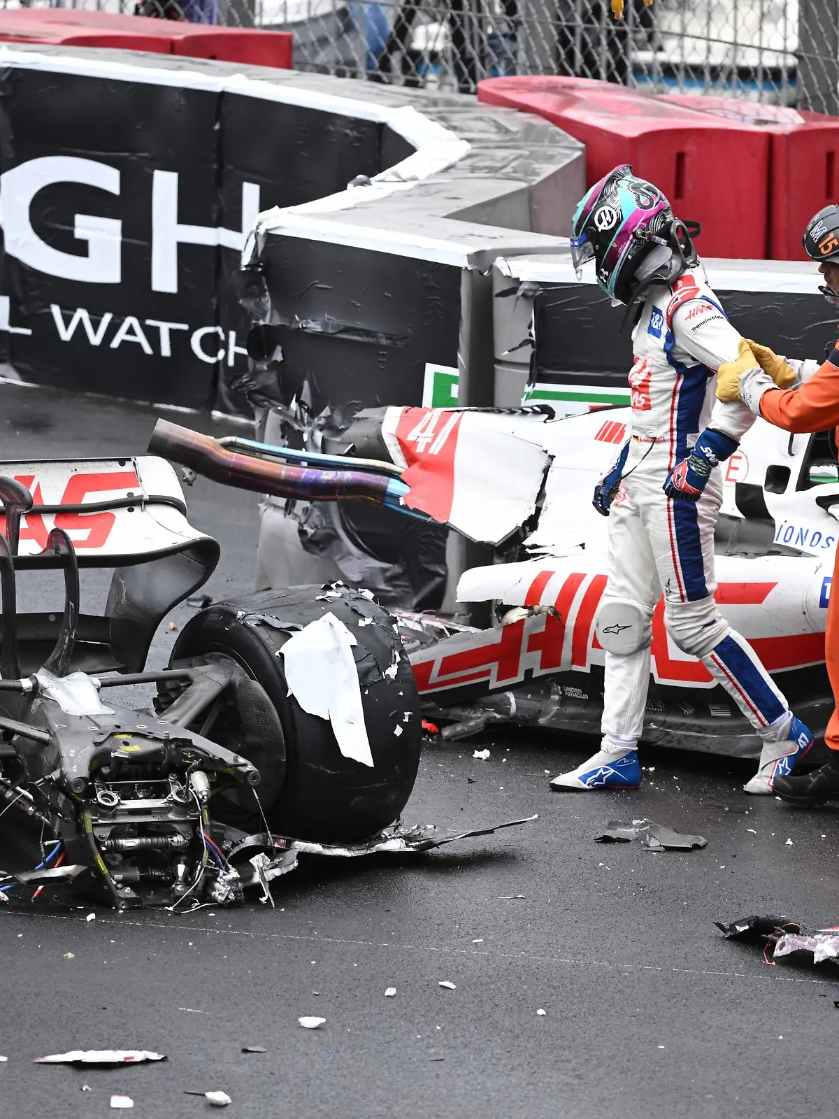 Haas driver Mick Schumacher of Germany leaves his car after crashing during the Monaco Formula One Grand Prix, at the Monaco racetrack, in Monaco, Sunday, May 29, 2022. (Pool Photo/Christian Bruna/Via AP)