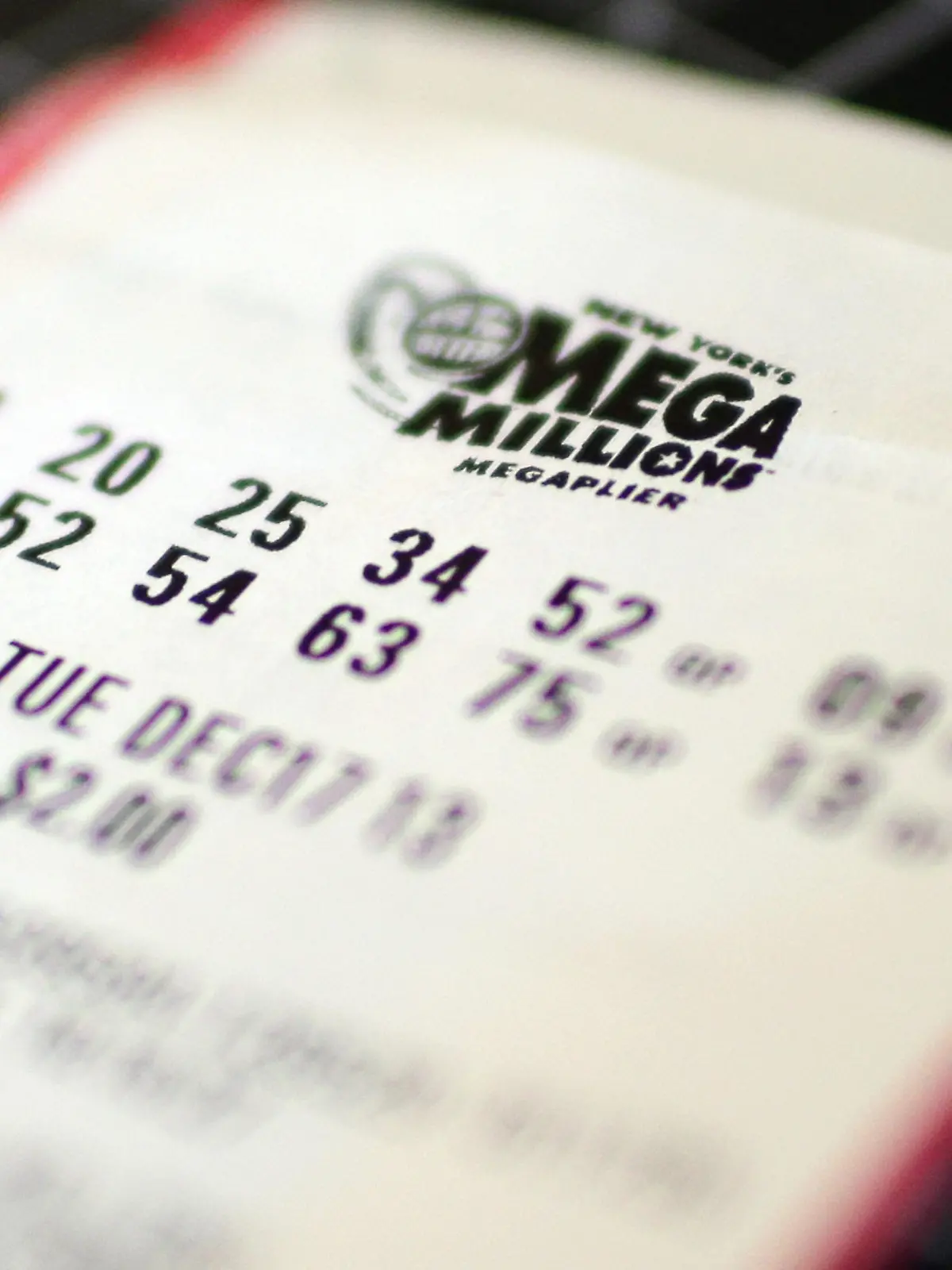 Image #: 26078533    Two Mega Millions tickets for the Tuesday December 17th jackpot lay one on top of the other In New York City on December 16, 2013. The Mega Millions jackpot has been boosted to $586 million, a jump from the earlier projection but still trailing a $656 million prize last year that was the largest in U.S. history.     UPI/John Angelillo /LANDOV Keine Weitergabe an Drittverwerter.