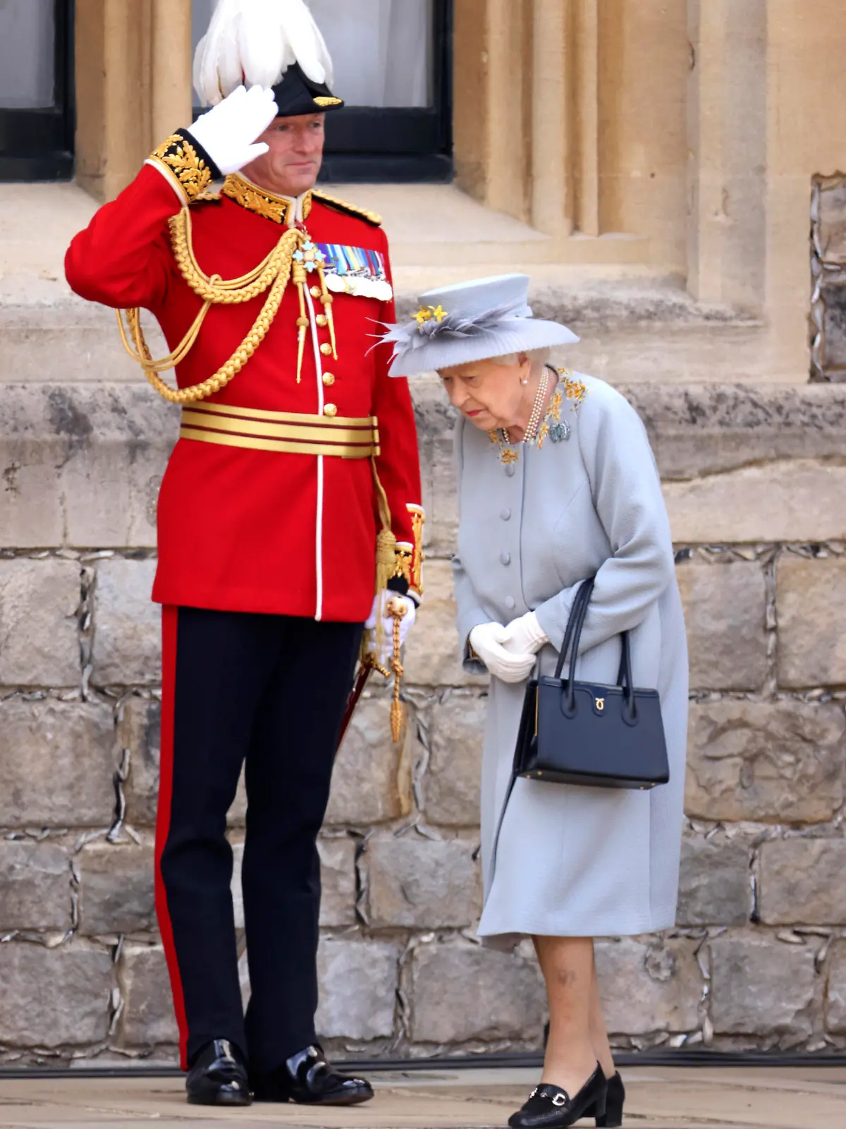 Britain's Queen Elizabeth II leaves after watching a military ceremony to mark her official birthday at Windsor Castle, Windsor, England, Saturday June 12, 2021. In line with government advice The Queen's Birthday Parade, also known as Trooping the Colour, will not go ahead in its traditional form. (Chris Jackson/Pool via AP)