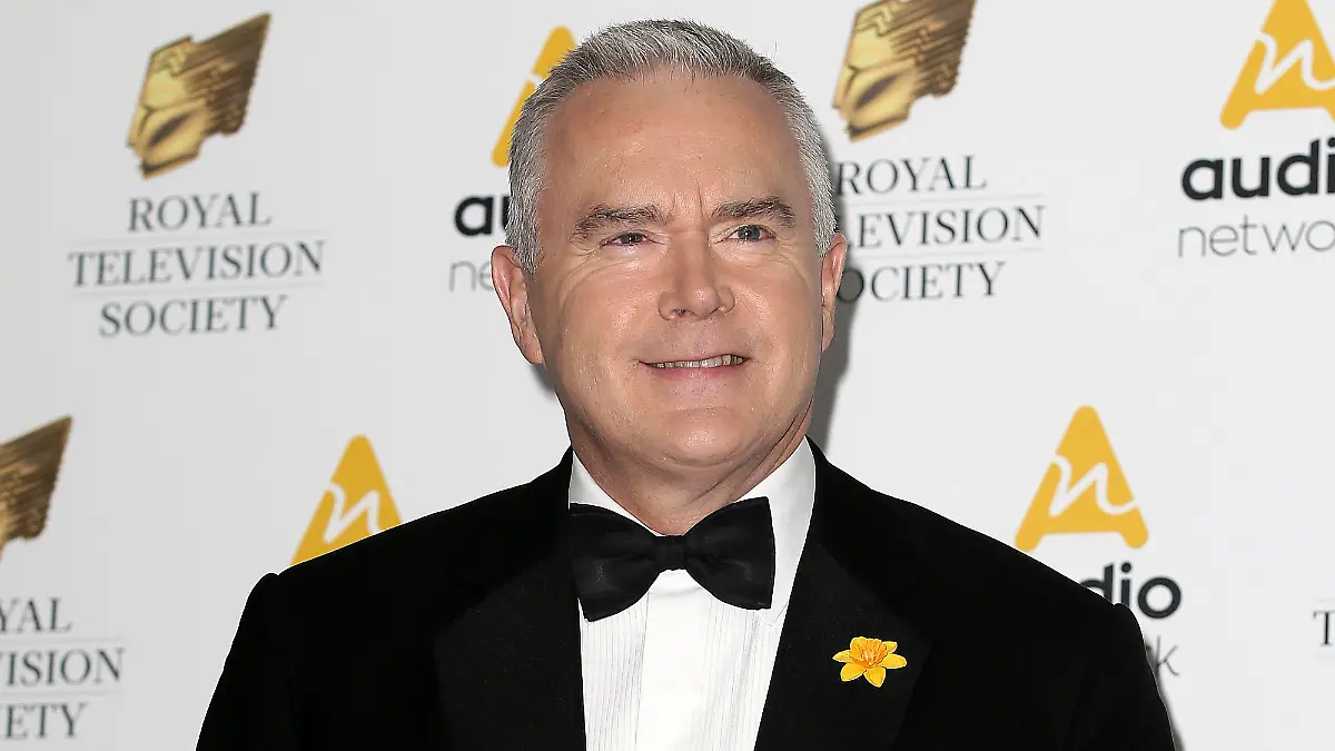 FILE - Journalist Huw Edwards poses for photographers upon arrival at the Royal Television Society Programme Awards at the Grosvenor Hotel in London, Tuesday, March 21, 2017. London police say there's no evidence that a BBC presenter who allegedly paid a teenager for sexually explicit photos committed a crime. The Metropolitan police issued the statement Wednesday, July 12, 2023 as the wife of Huw Edwards identified him as the presenter.  (AP Photos/Tim Ireland, File)