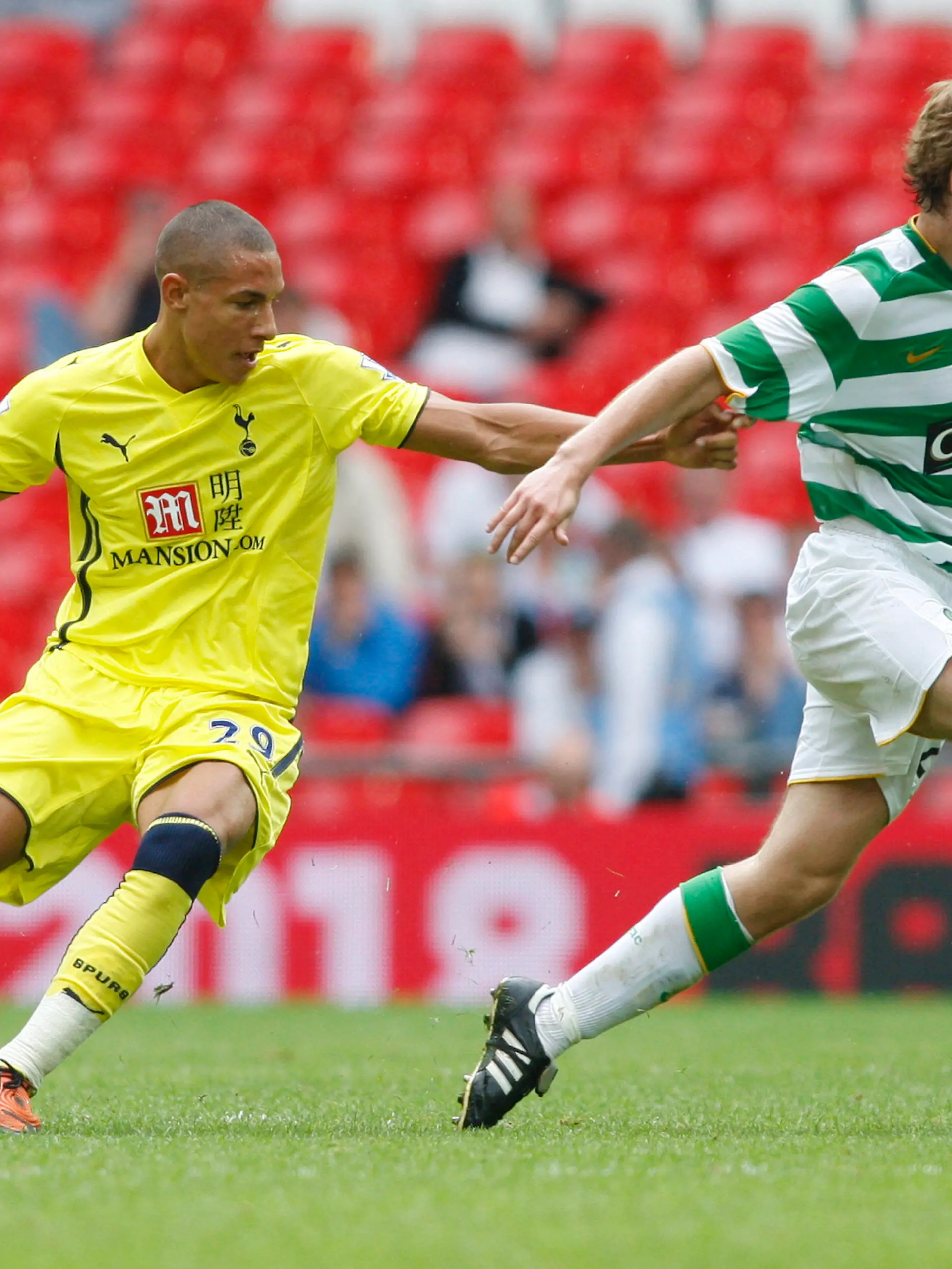 Tottenham Hotspur's Jake Livermure, left, competes with Celtic's Paddy McCourt during their Wembley Cup soccer match at Wembley Stadium, London, Sunday, July 26, 2009. (AP Photo/Sang Tan)
