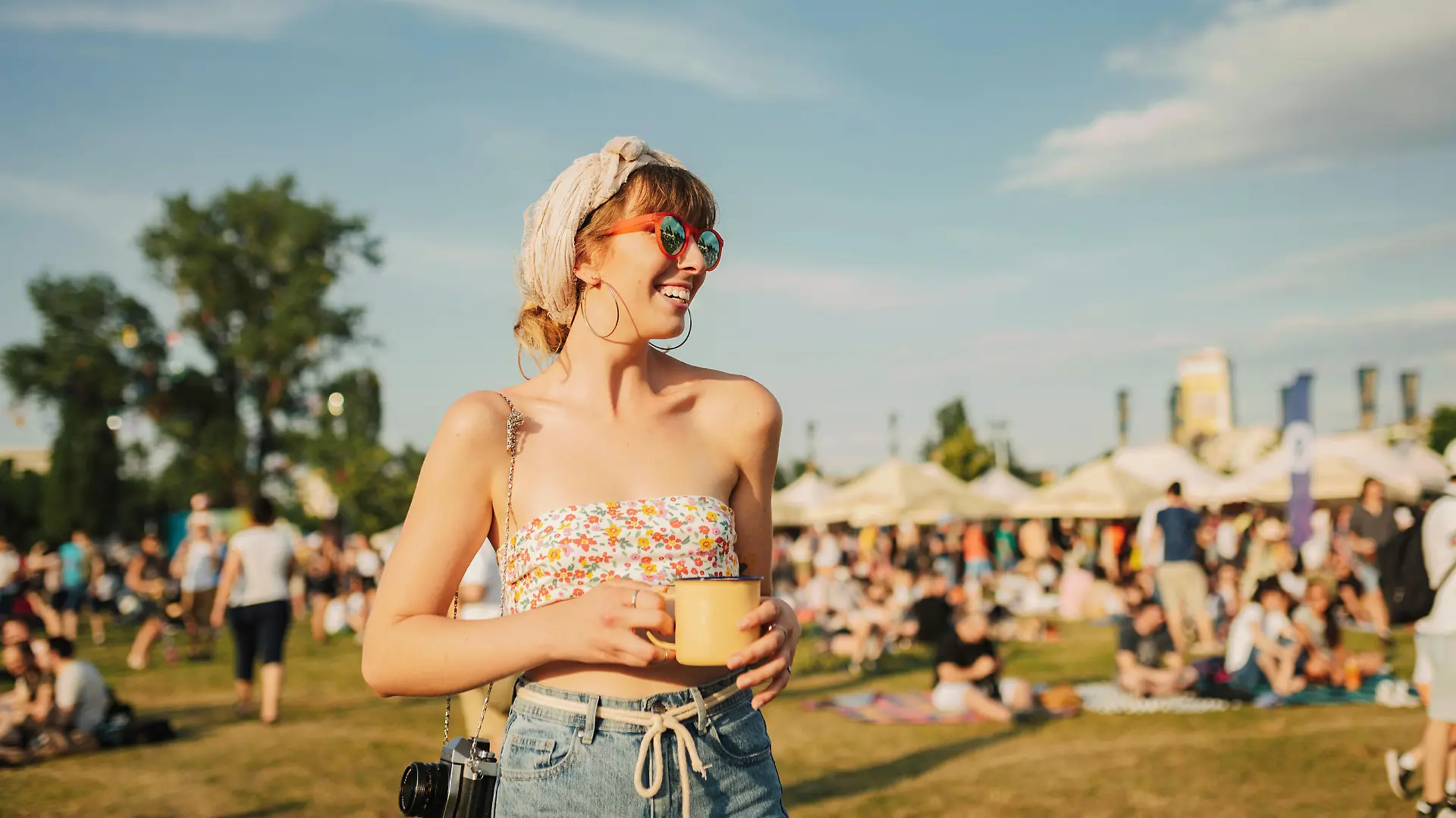 Young woman enjoys a warm summer day. Festival lady.