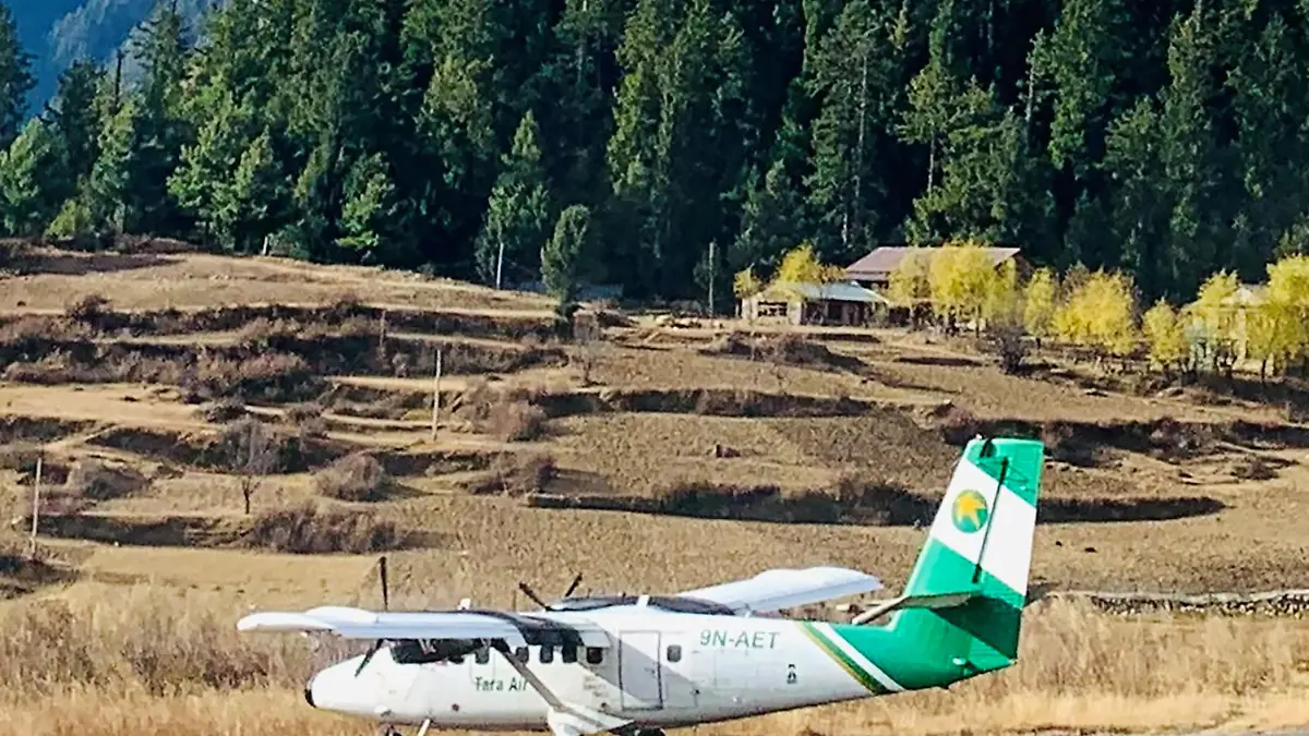 Handout image shows Tara Air's DHC-6 Twin Otter, tail number 9N-AET, in Simikot, Nepal December 1, 2021. Picture taken December 1, 2021. Madhu Thapa/Handout via REUTERS ATTENTION EDITORS - THIS IMAGE HAS BEEN SUPPLIED BY A THIRD PARTY. NO RESALES. NO ARCHIVES. MANDATORY CREDIT. THIS PICTURE WAS PROCESSED BY REUTERS TO ENHANCE QUALITY. AN UNPROCESSED VERSION HAS BEEN PROVIDED SEPARATELY.