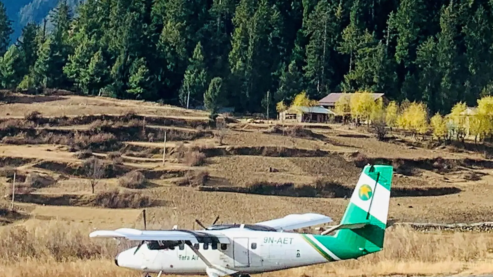 Handout image shows Tara Air's DHC-6 Twin Otter, tail number 9N-AET, in Simikot, Nepal December 1, 2021. Picture taken December 1, 2021. Madhu Thapa/Handout via REUTERS ATTENTION EDITORS - THIS IMAGE HAS BEEN SUPPLIED BY A THIRD PARTY. NO RESALES. NO ARCHIVES. MANDATORY CREDIT. THIS PICTURE WAS PROCESSED BY REUTERS TO ENHANCE QUALITY. AN UNPROCESSED VERSION HAS BEEN PROVIDED SEPARATELY.