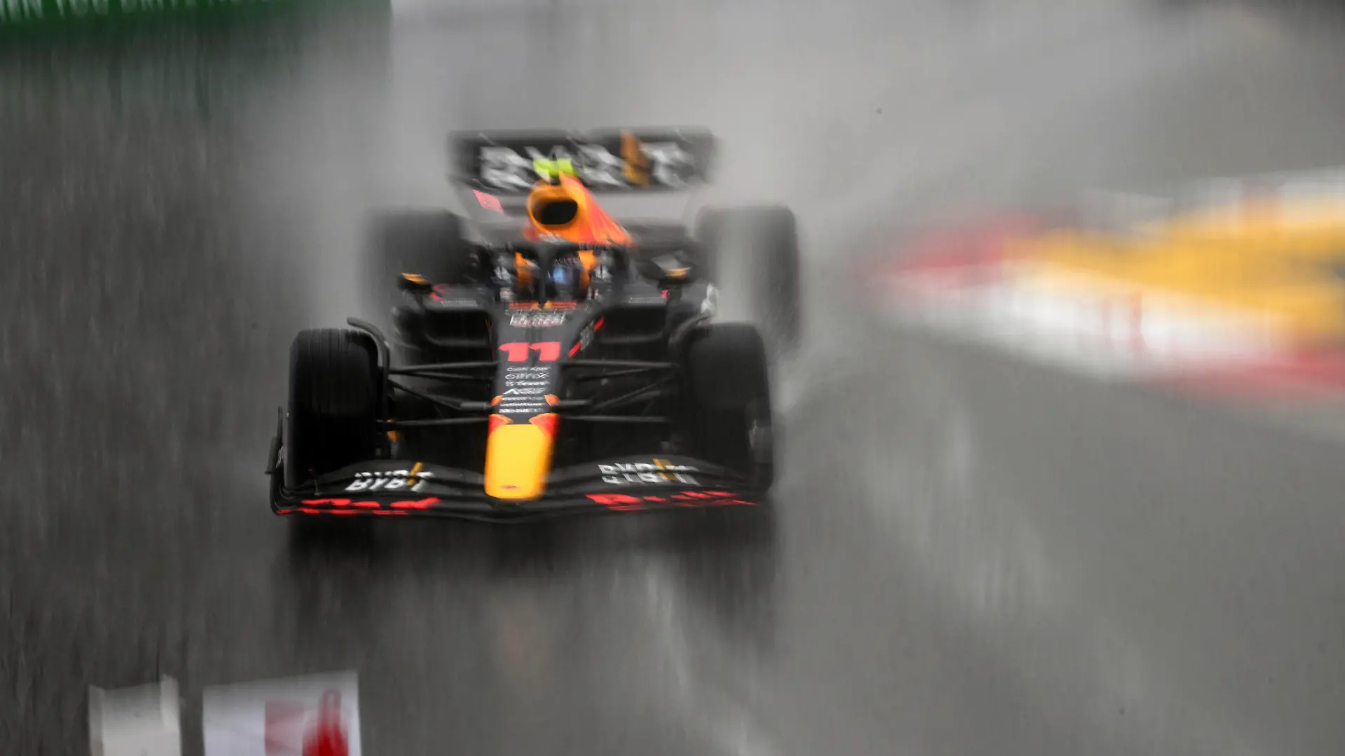 Red Bull driver Sergio Perez of Mexico warms up his car under heavy rain prior to the start of the Monaco Formula One Grand Prix, at the Monaco racetrack, in Monaco, Sunday, May 29, 2022. (Pool Photo/Christian Bruna/Via AP)