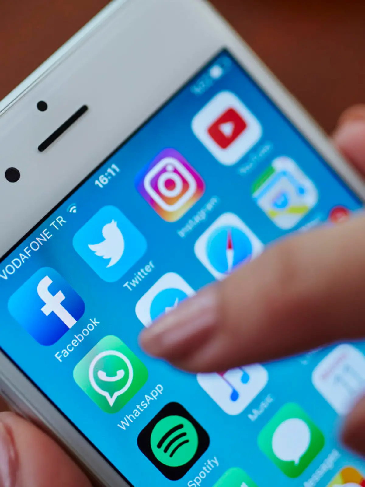 Istanbul, Turkey - July 11, 2016: Apple iPhone 6s screen with social media applications icons Facebook, Instagram, Twitter, Spotify, Youtube, Messenger, Apple Music, Safari, Maps, Whatsapp etc.