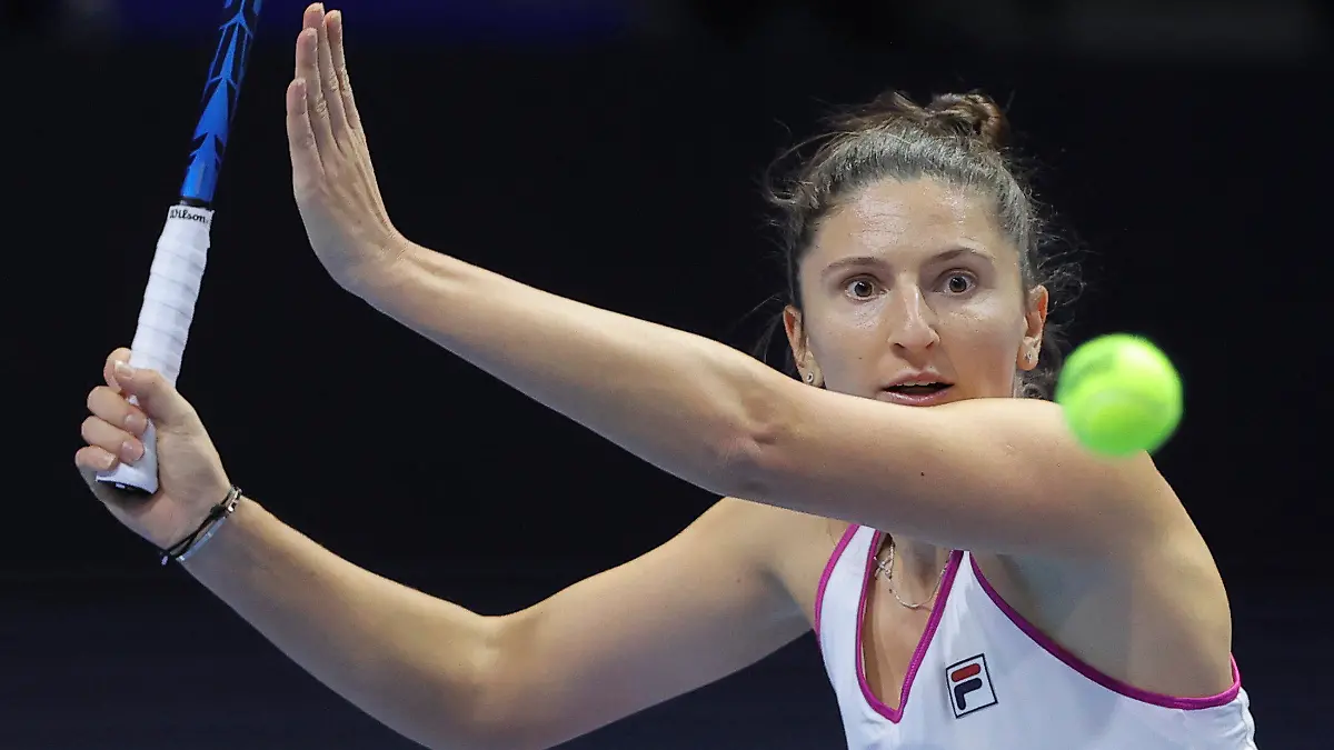 FILE - Irina-Camelia Begu of Romania returns the ball to Maria Sakkari of Greece during the St. Petersburg Ladies Trophy tennis tournament semi-final match in St.Petersburg, Russia, Saturday, Feb. 12, 2022. at the French Open was allowed to continue her match -- and ended up winning it -- after she threw her racket and it bounced into the stands, the latest in a series of episodes involving professional tennis players who take their anger out on their equipment. (AP Photo/Elena Ignatyeva, File)