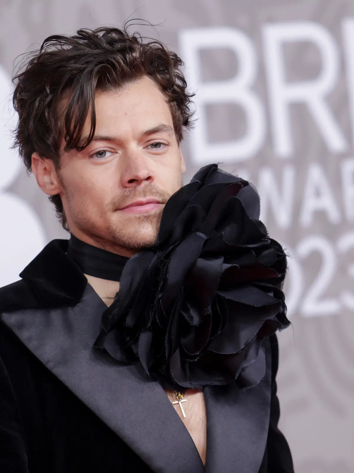 Harry Styles poses for photographers upon arrival at the Brit Awards 2023 in London, Saturday, Feb. 11, 2023. (Photo by Vianney Le Caer/Invision/AP)