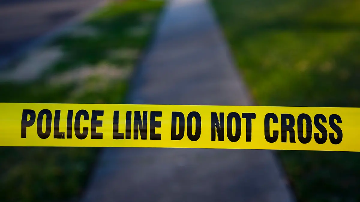 FILE - Police tape cordons off the scene of a crime in Levittown, Pa., Saturday, March 16, 2024. Police departments reported a year-over-year increase in sworn officers in 2023 for the first time since the COVID-19 pandemic began and since the 2020 police killing of George Floyd spurred nationwide protests and increased scrutiny of police, according to a survey released by the Police Executive Research Forum. (AP Photo/Matt Rourke, File)