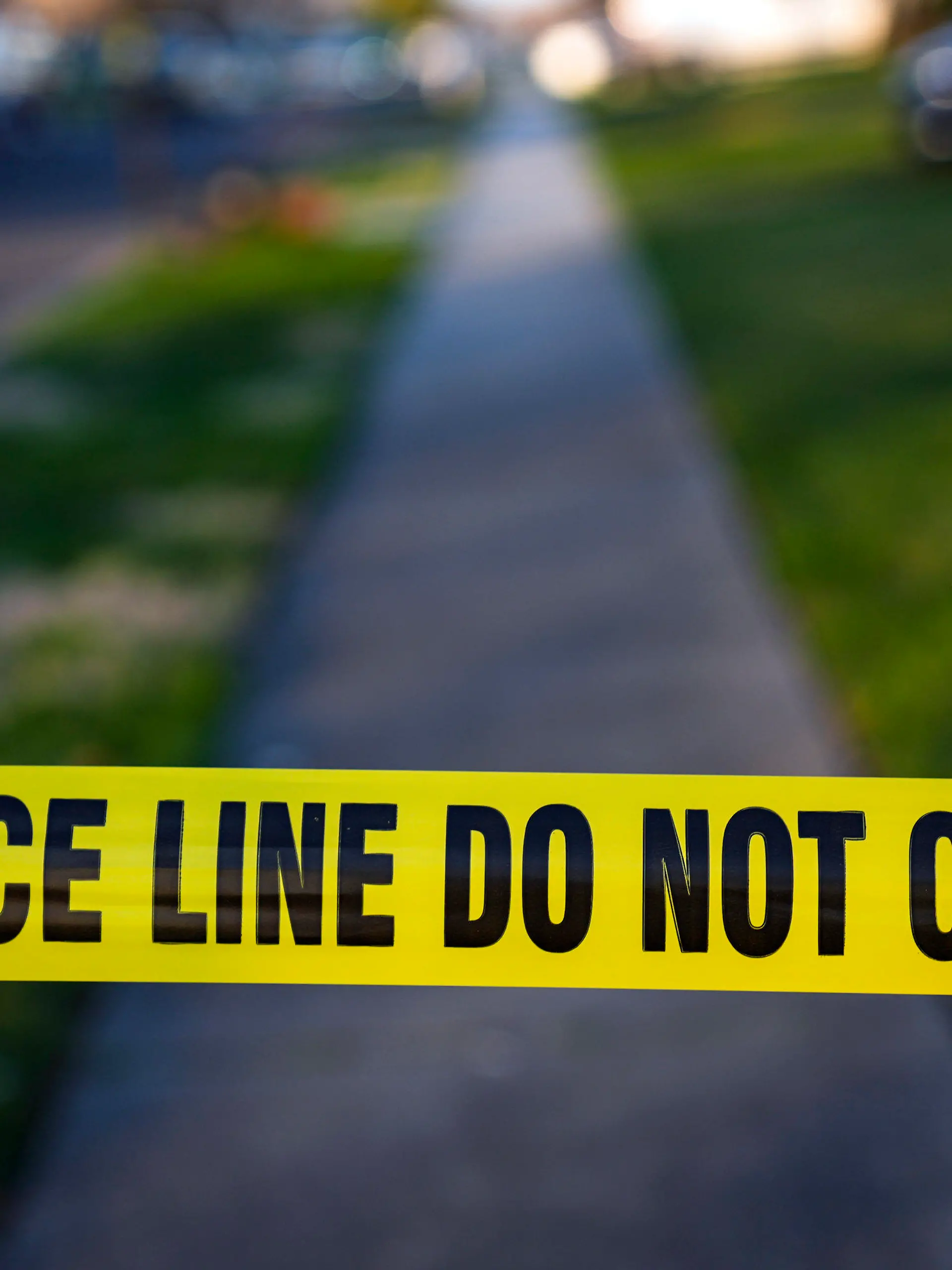 FILE -  Police tape cordons off the scene of a crime in Levittown, Pa., Saturday, March 16, 2024. Police departments reported a year-over-year increase in sworn officers in 2023 for the first time since the COVID-19 pandemic began and since the 2020 police killing of George Floyd spurred nationwide protests and increased scrutiny of police, according to a survey released by the Police Executive Research Forum.  (AP Photo/Matt Rourke, File)