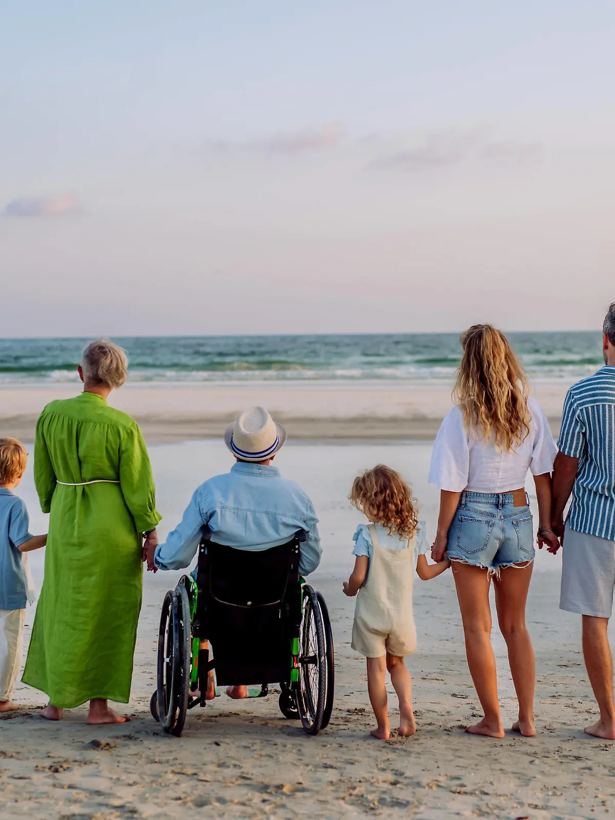 Rear view of three geneartions family with little kids enjoying time at sea in exotic country. Rear view of three geneartions family with little kids enjoying time at sea in an exotic country. model released Copyright: xx HHH BODOVCI OMAN 2022 HHH 182