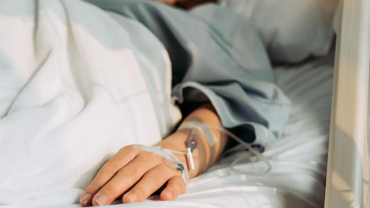 Asian woman lying sick in hospital.