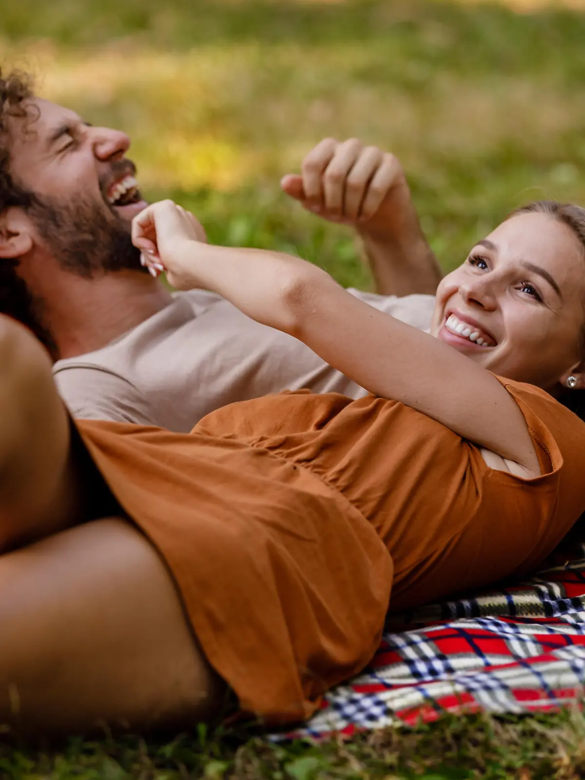 Engaged Couple is Relaxing in Summer Park and Enjoying in Exotic Fruit, Showing Lovely Emotions to Each Other.