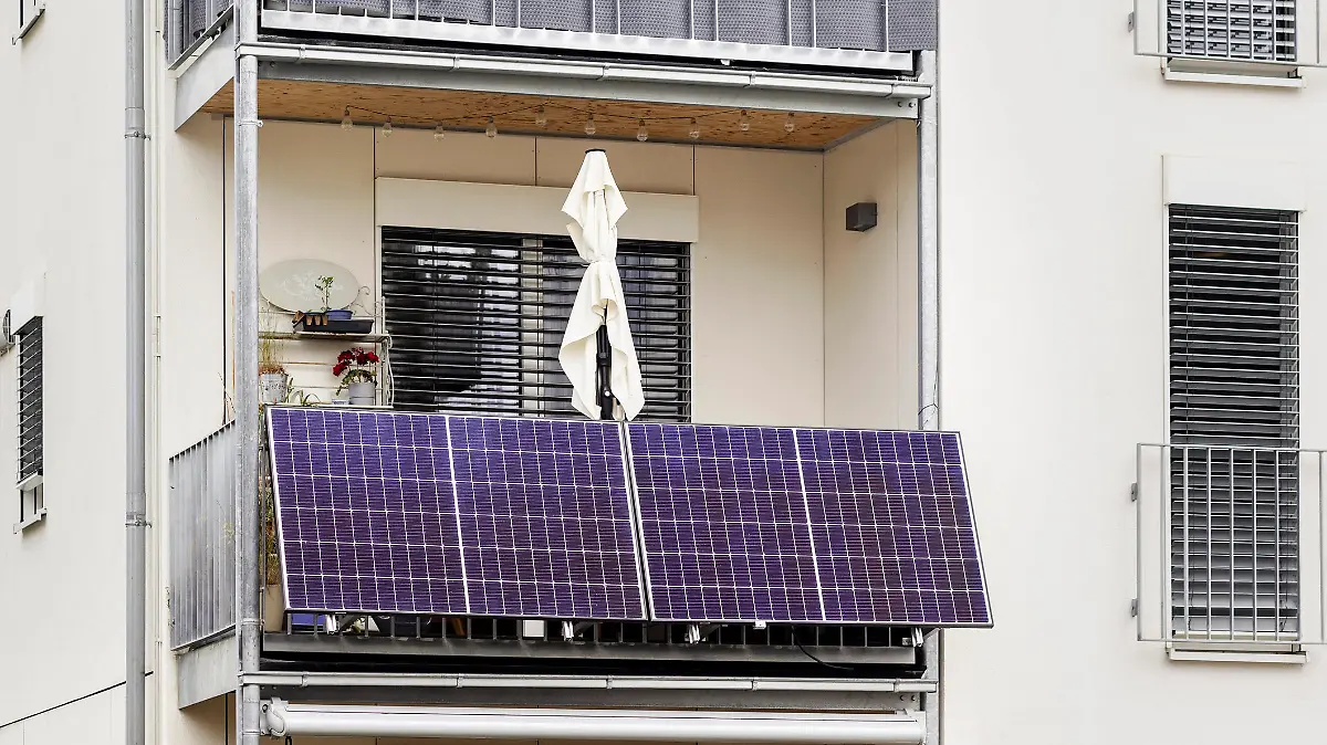 Balcony Solar Panels. Modern Mini Solar Panel System on Balcony of Apartment Building in City. Green Power Energy of Modern Flat.