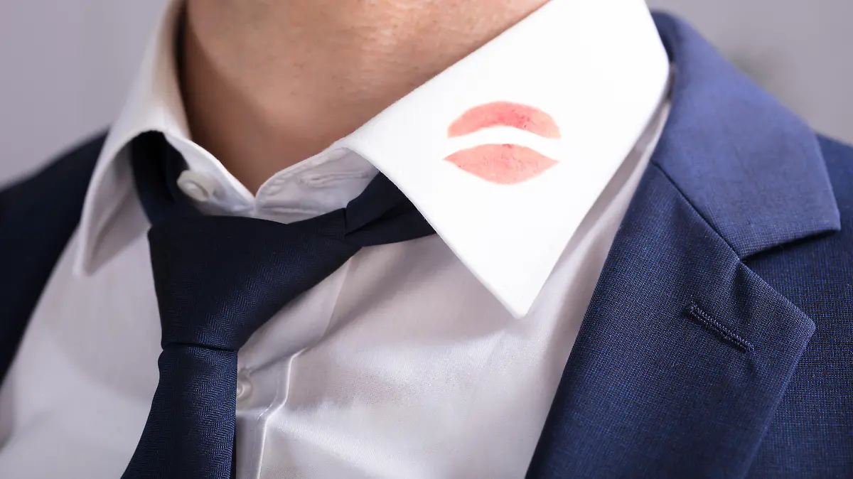 Close-up Of A Businessman With Lipstick Kiss Marks On Shirt's Collar