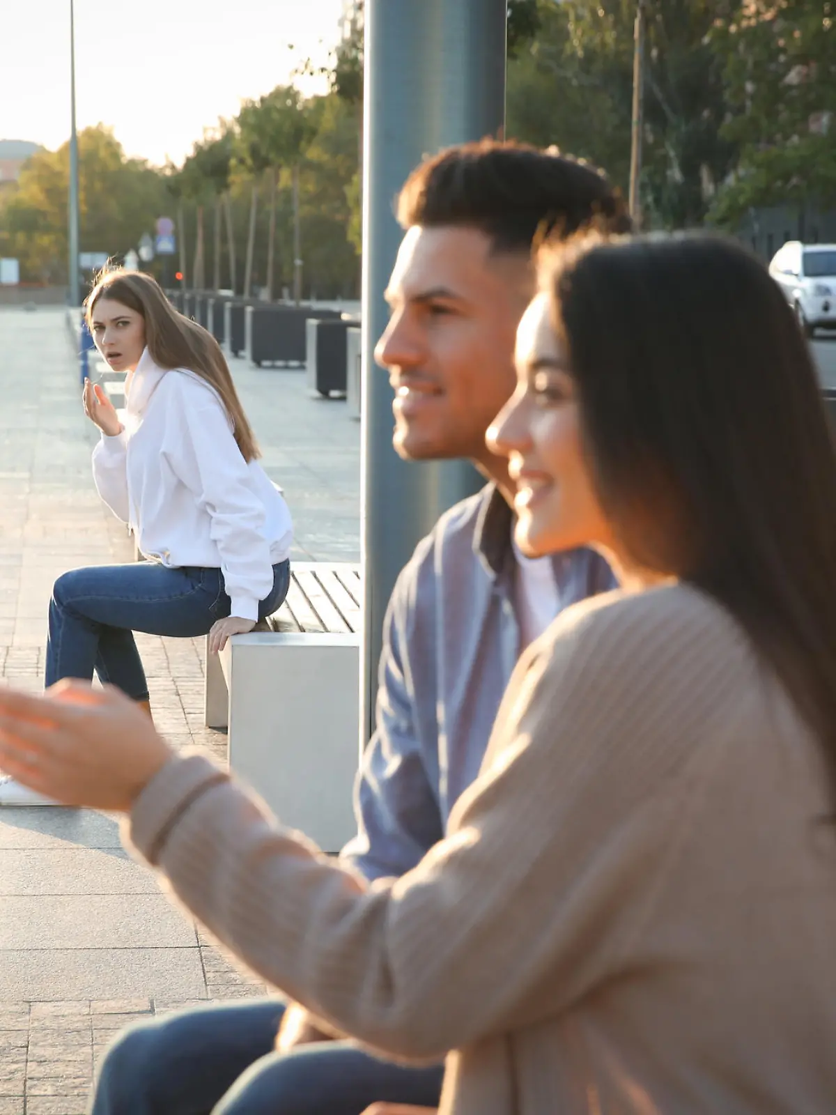 Jealous ex girlfriend spying on couple outdoors