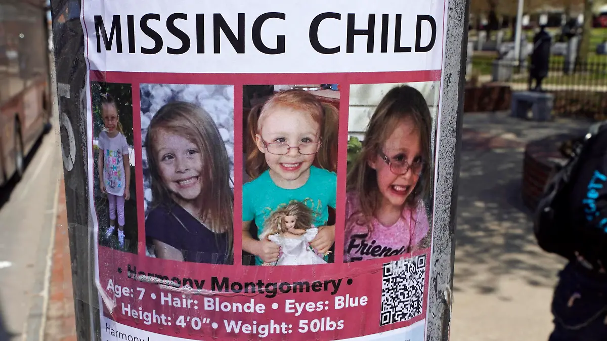FILE - A man walks past the "missing child" poster for Harmony Montgomery on Thursday, May 5, 2022, in Manchester, N.H. Jury selection starts Tuesday, Feb. 13, 2024 for a New Hampshire man accused of killing his 5-year-old daughter and spending months moving and hiding her body. Adam Montgomery is charged with second-degree murder in the death of his daughter, Harmony, who was reported missing in November 2021, nearly two years after police believe she was killed in Manchester. Her body has not been found. (AP Photo/Charles Krupa, File)
