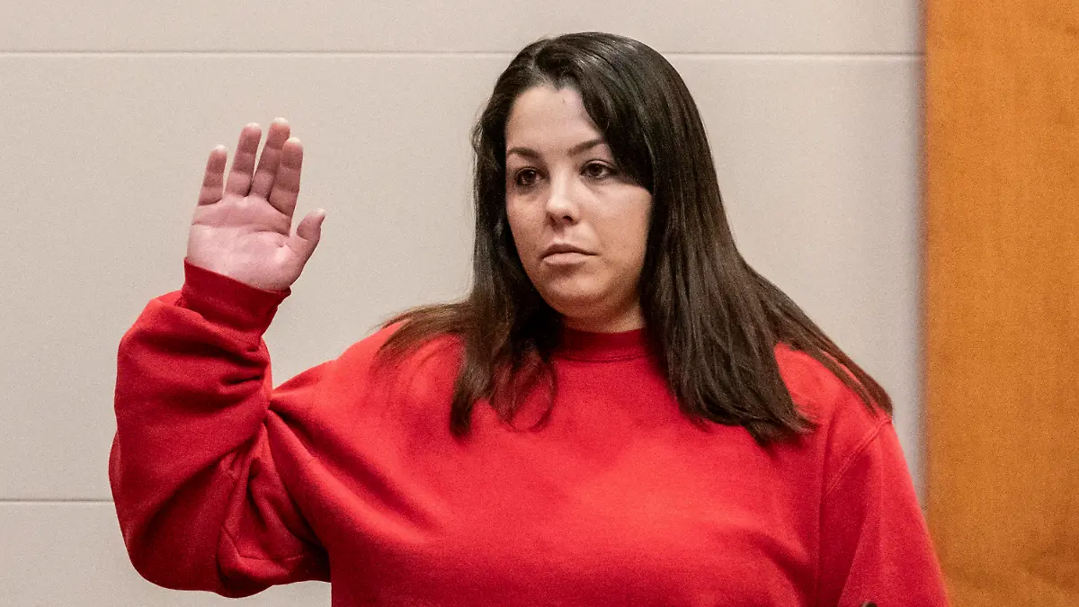 Kayla Montgomery is sworn in by prosecutor Christopher Knowles before testifying at the trial of Adam Montgomery at Hillsborough County Superior Court in Manchester, N.H, on Friday, Feb. 9, 2024. Adam Montgomery is accused of killing his 5-year-old daughter and spending months moving her body before disposing of it. (Jeffrey Hastings/Pool Photo via AP)