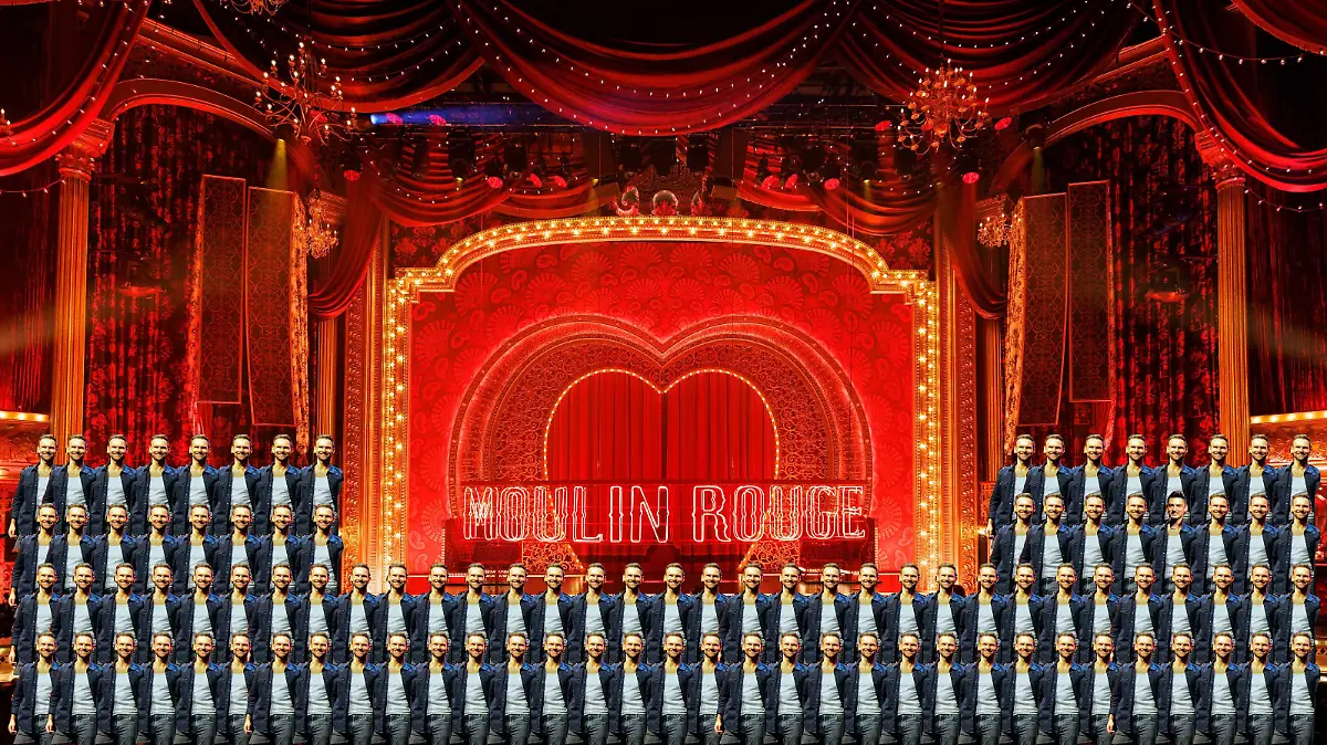 Die Darsteller des Musical 'Moulin Rouge! Das Musical' zeigen kleine Ausschnitte aus der Show die in Kürze im Kölner Musical Dome Premiere feiert. Das Bühnenbild ist in Rot gehalten und von einer roten Windmühle und einem blauen Elefanten gesäumt. Köln, 03.11.2022