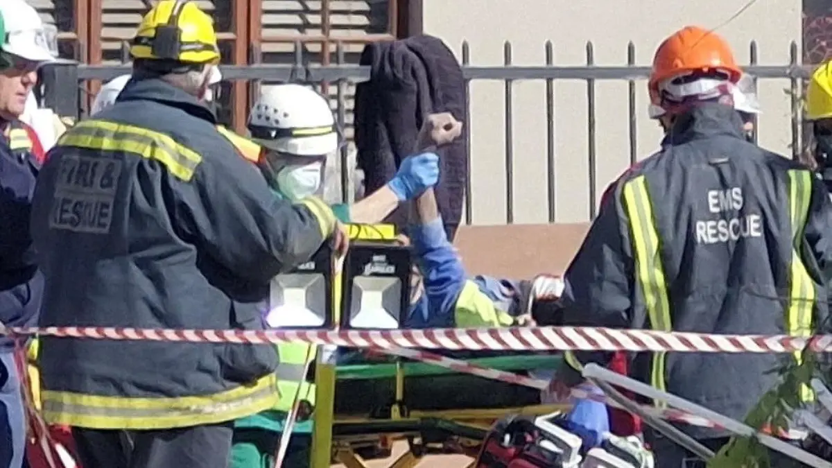 A man raises his hand as rescue workers carry him to an ambulance after being rescued having survived 118 hours after a deadly building collapse in George, South Africa May 11, 2024, Herman Pieters/Garden Route District Municipality/Handout via REUTERS    THIS IMAGE HAS BEEN SUPPLIED BY A THIRD PARTY