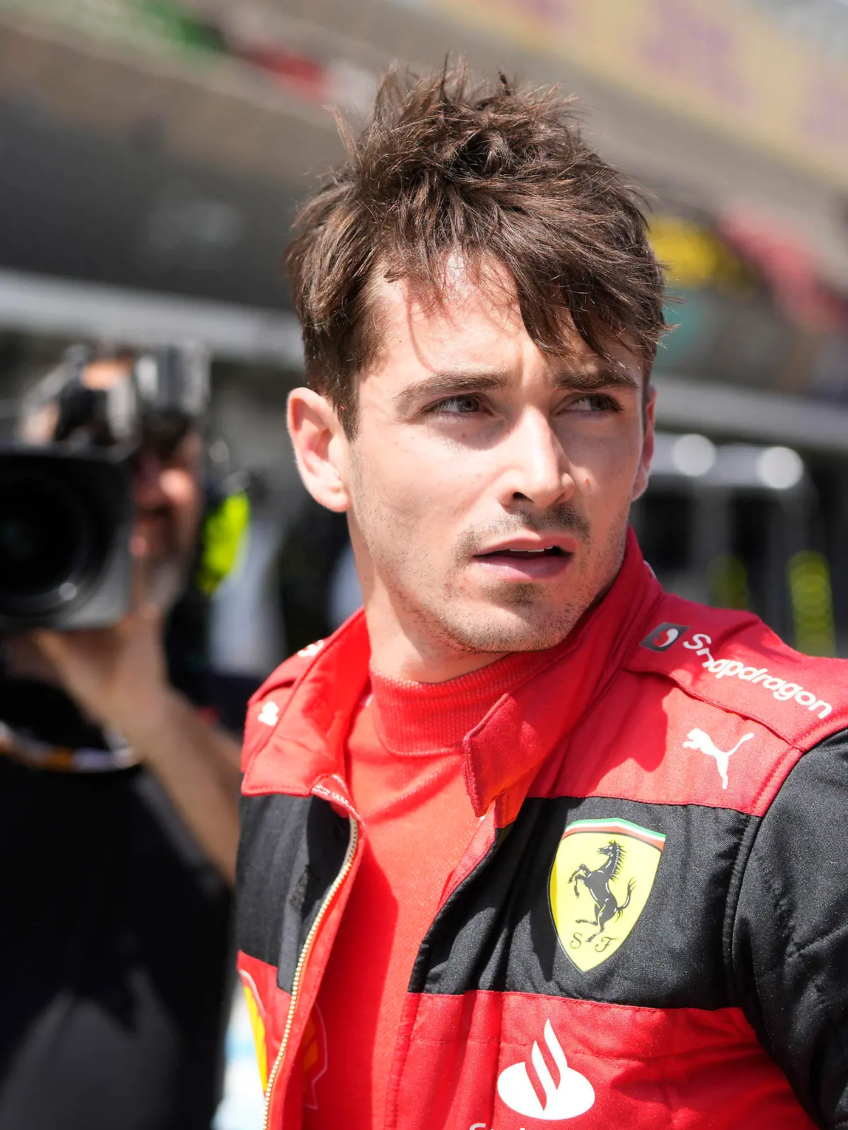 Ferrari driver Charles Leclerc of Monaco walks at the pit lane after his car's breakdown during the Spanish Formula One Grand Prix at the Barcelona Catalunya racetrack in Montmelo, Spain, Sunday, May 22, 2022. (AP Photo/Pool/Manu Fernandez)
