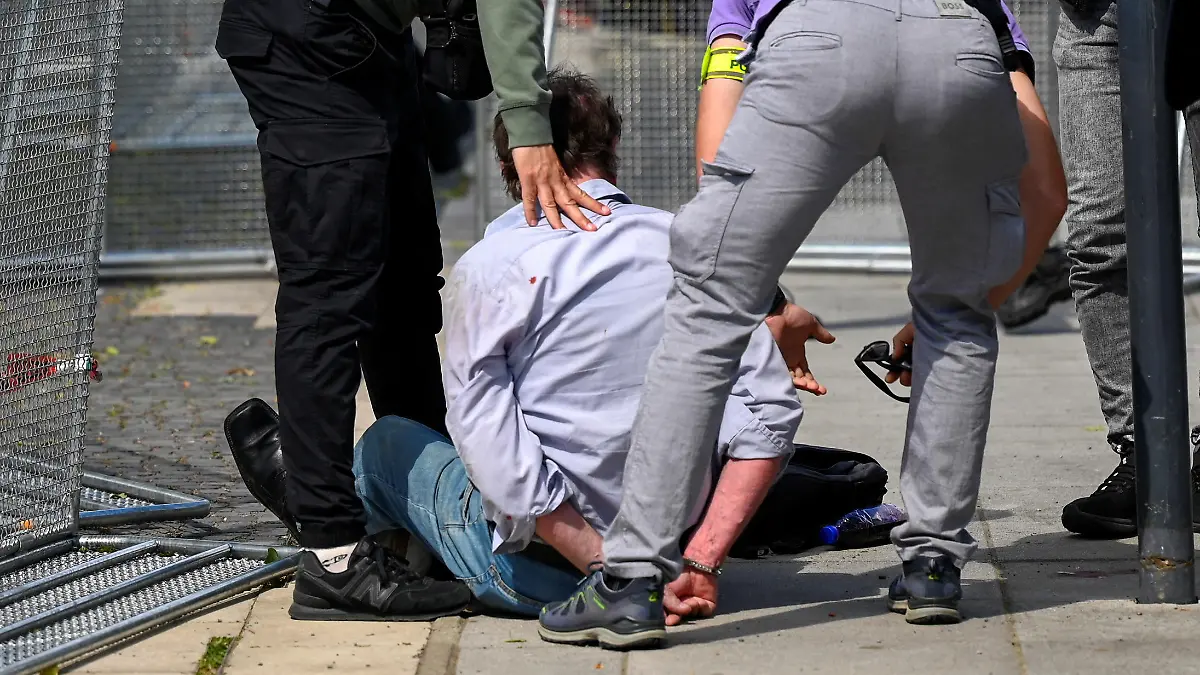 A person is detained after shooting incident of Slovak PM Robert Fico, after a Slovak government meeting in Handlova, Slovakia, May 15, 2024. REUTERS/Radovan Stoklasa