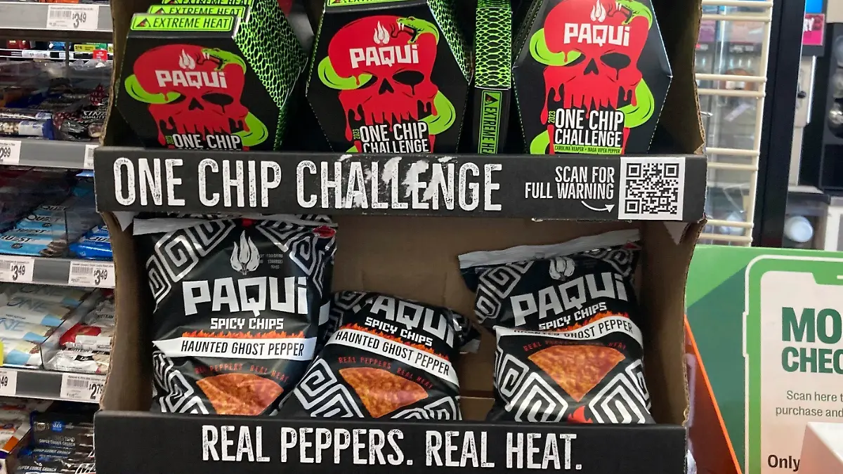 FILE - Paqui One Chip Challenge chips are displayed at a 7-Eleven store in Boston, Thursday, Sept. 7, 2023, before they were removed the following day. A medical examiner says a Massachusetts teen who participated in a spicy tortilla chip challenge died from ingesting a substance “with a high capsaicin concentration,” according to autopsy results The Associated Press obtained late Wednesday, May 15, 2024. Capsaicin is a chili pepper extract. Harris Wolobah died on Sept. 1, 2023, after eating the chip. (AP Photo/Steve LeBlanc, File)