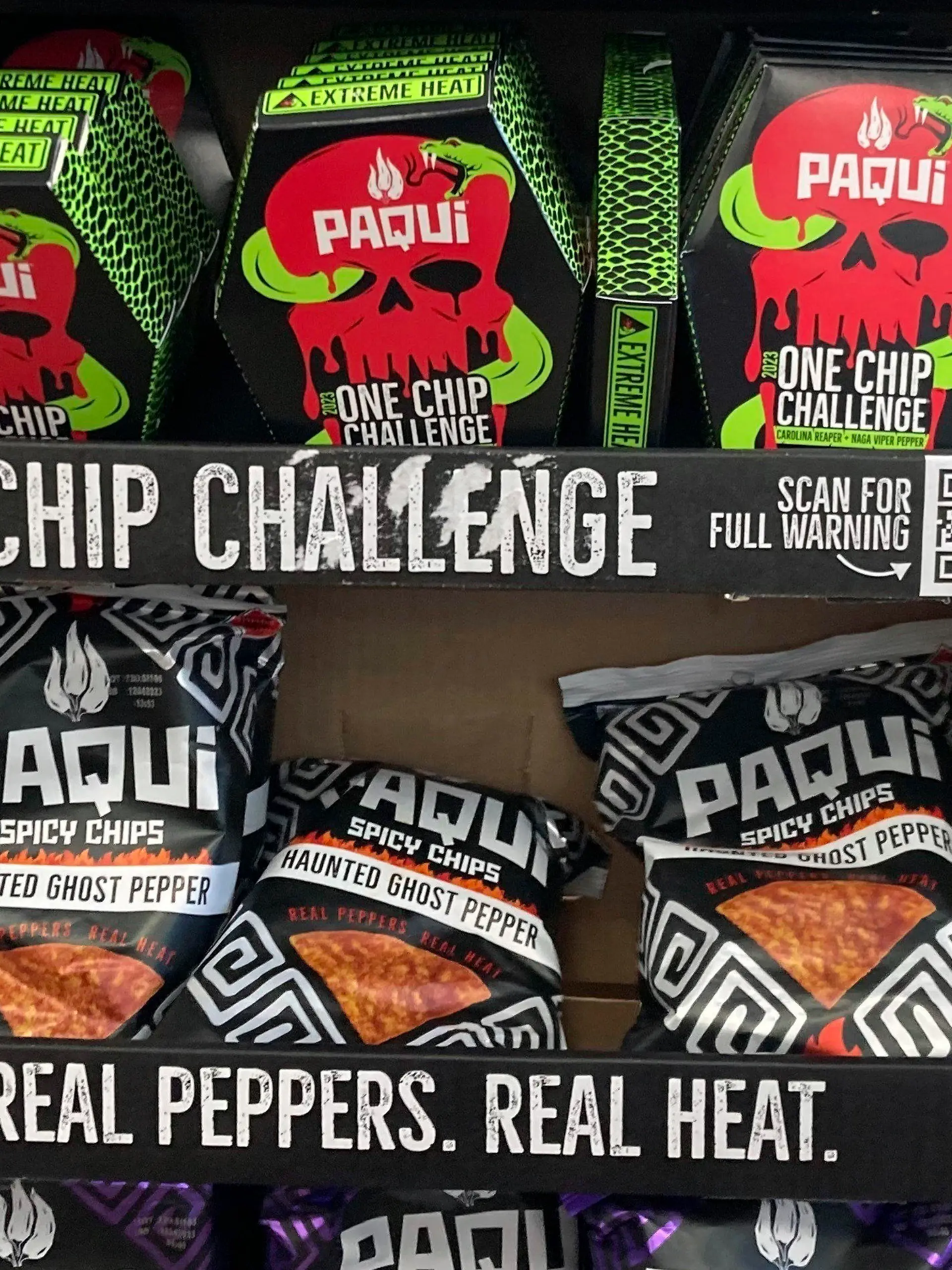 FILE - Paqui One Chip Challenge chips are displayed at a 7-Eleven store in Boston, Thursday, Sept. 7, 2023, before they were removed the following day. A medical examiner says a Massachusetts teen who participated in a spicy tortilla chip challenge died from ingesting a substance “with a high capsaicin concentration,” according to autopsy results The Associated Press obtained late Wednesday, May 15, 2024. Capsaicin is a chili pepper extract. Harris Wolobah died on Sept. 1, 2023, after eating the chip. (AP Photo/Steve LeBlanc, File)