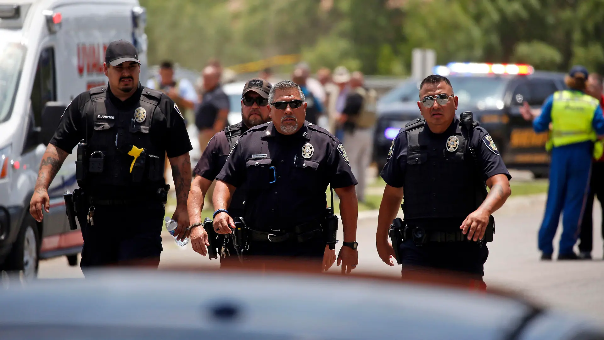 Police walk near Robb Elementary School following a shooting, Tuesday, May 24, 2022, in Uvalde, Texas. (AP Photo/Dario Lopez-Mills)