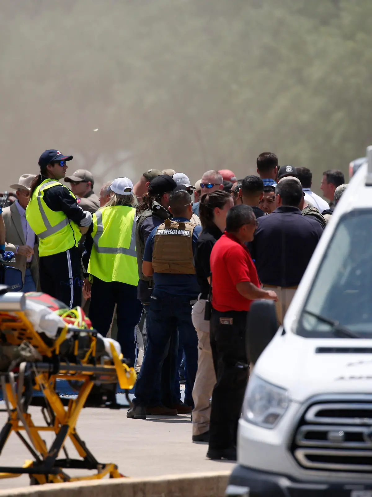 Emergency personnel gather near Robb Elementary School following a shooting, Tuesday, May 24, 2022, in Uvalde, Texas. (AP Photo/Dario Lopez-Mills)