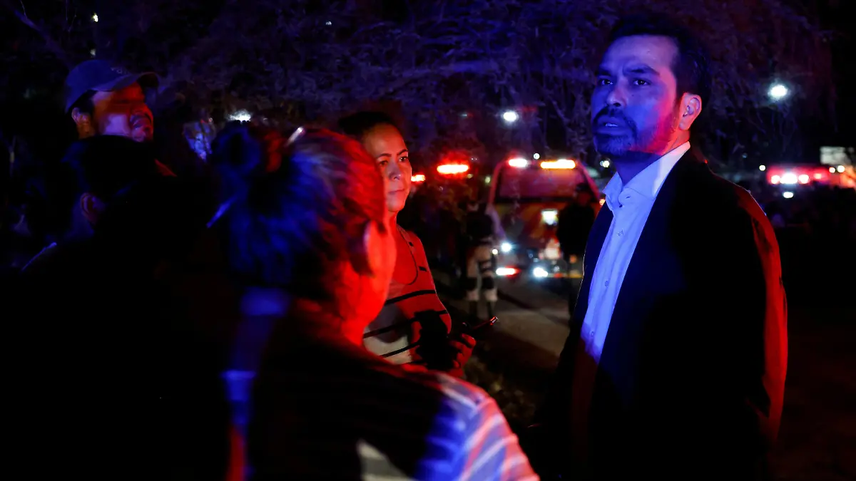 Presidential candidate of the Citizen's Movement Party Jorge Alvarez Maynez talks to people at the site after a gust of wind caused a structure to collapse, resulting in multiple fatalities and injuries, at a campaign event for the Citizens' Movement party, in San Pedro Garza Garcia, Nuevo Leon, Mexico May 22, 2024. REUTERS/Daniel Becerril