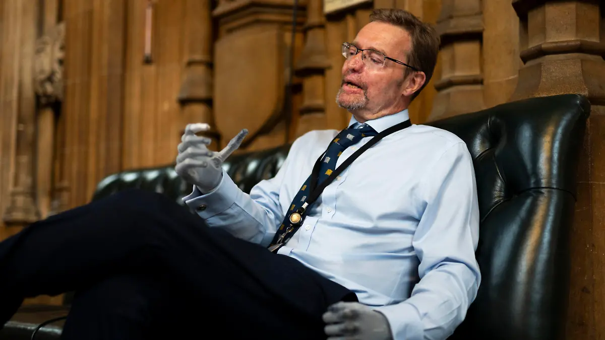 Conservative legislator Craig Mackinlay speaks during an interview in the Central Lobby of the Palace of Westminster, London, Wednesday May 22, 2024. Mackinlay returned to work six months after sepsis put him in a coma and forced the amputation of his hands and feet.  (Jordan Pettitt/PA via AP)
