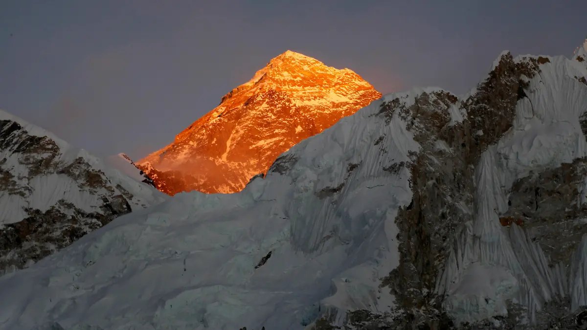 FILE - In this Nov. 12, 2015, file photo, Mt. Everest is seen from the way to Kalapatthar in Nepal. A Kenyan climber attempting to scale the world’s highest mountain has been found dead near the summit. A government official based at the base camp of Mount Everest says the body of Cheruiyot Kirui was found on the mountain. It was unclear when the body would be recovered because it would be difficult to carry at that altitude due to the low oxygen level. (AP Photo/Tashi Sherpa, File)
