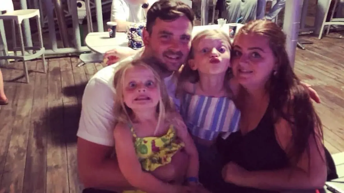 PIX FROM Kennedy News & Media (Pictured: MEGAN GRIEVES, 36, WITH HER 36-YEAR-OLD HUSBAND JAKE GRIEVES AND MEGAN'S TWO CHILDREN 14-YEAR-OLD CAOIMHE DEXTER - GRIEVES AND NINE-YEAR-OLD FARREN GRIEVES.) A mum has been left with a giant 'CRATER' in her leg after she claims doctors dismissed her cancer as 'flaky skin' for a decade - but her DEAD GRAN knew best and 'saved her life'. Megan Grieves, from Leicester in Leicestershire, says she attended more than 30 GP appointments during a 10-year period after her late grandma June Evans, 69, raised concerns about a small mole on her left leg. The now 36-year-old claims her growing mole was passed off as dry skin at every check-up and was prescribed moisturising creams to treat the flaky patch on her shin. DISCLAIMER: While Kennedy News and Media uses its best endeavours to establish the copyright and authenticity of all pictures supplied, it accepts no liability for any damage, loss or legal action caused by the use of images supplied and the publication of images is solely at your discretion. SEE KENNEDY NEWS COPY - 0161 697 4266 