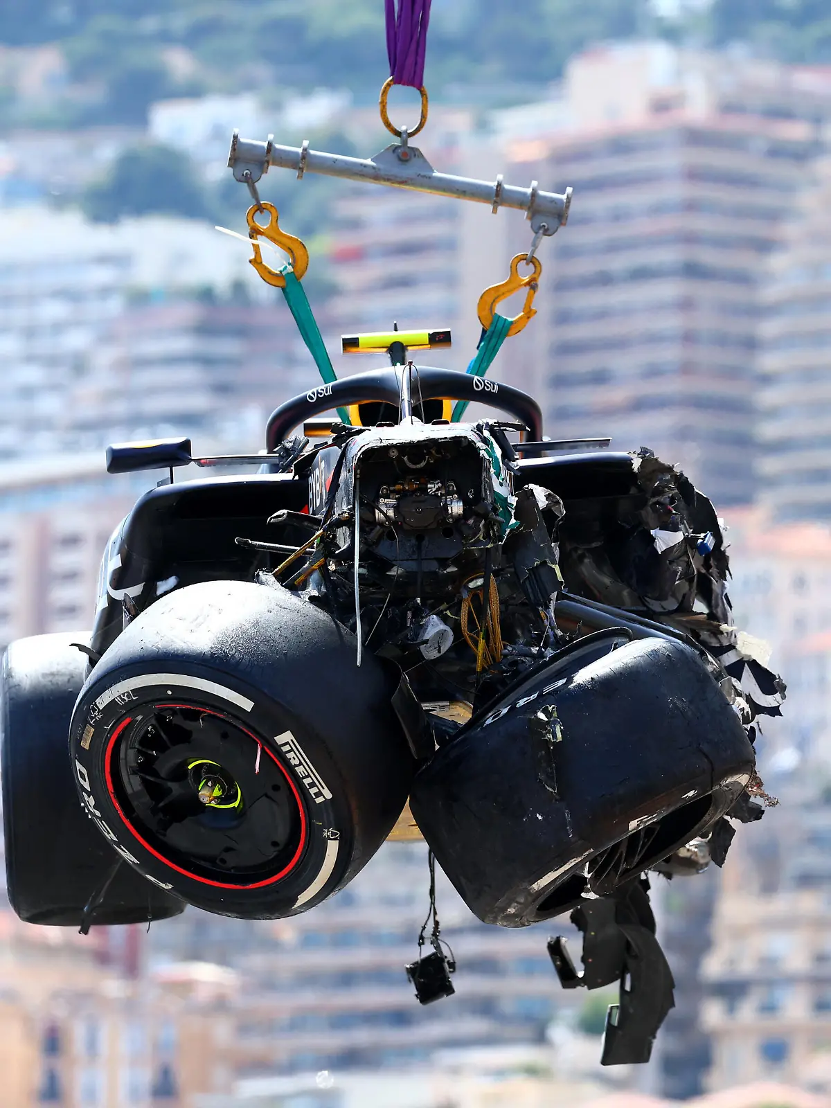 MONTE-CARLO, MONACO - MAY 26: The car of Sergio Perez of Mexico and Oracle Red Bull Racing is recovered from the track after crashing during the F1 Grand Prix of Monaco at Circuit de Monaco on May 26, 2024 in Monte-Carlo, Monaco. (Photo by Clive Rose/Getty Images)