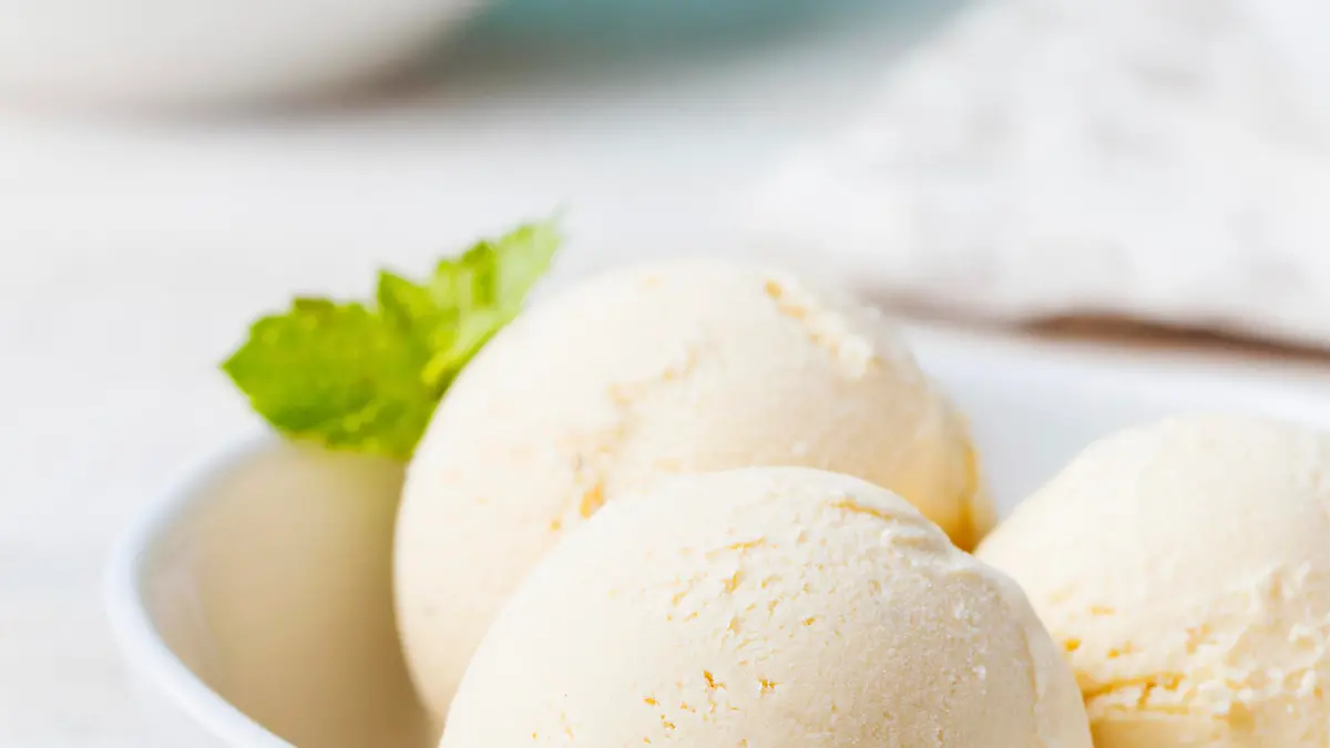 Vanilla Ice Cream with Mint in bowl Organic productVanilla Ice Cream with Mint in bowl Organic productVanilla Ice Cream with Mint in bowl Organic product