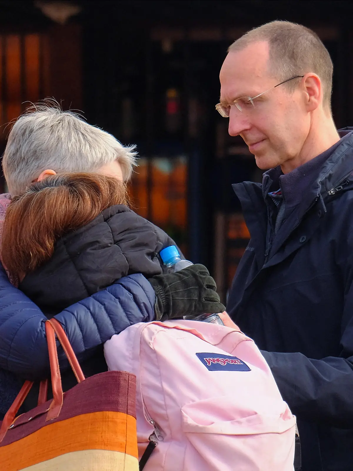 Peter and Cristina Horn, parents of Julia Horn, a missing 19-year-old German tourist, hug an unidentified person as rescuers work on the search for their daughter, at the Tres Marias hill in San Juan, Argentina May 27, 2024. REUTERS/Marcos Urisa
