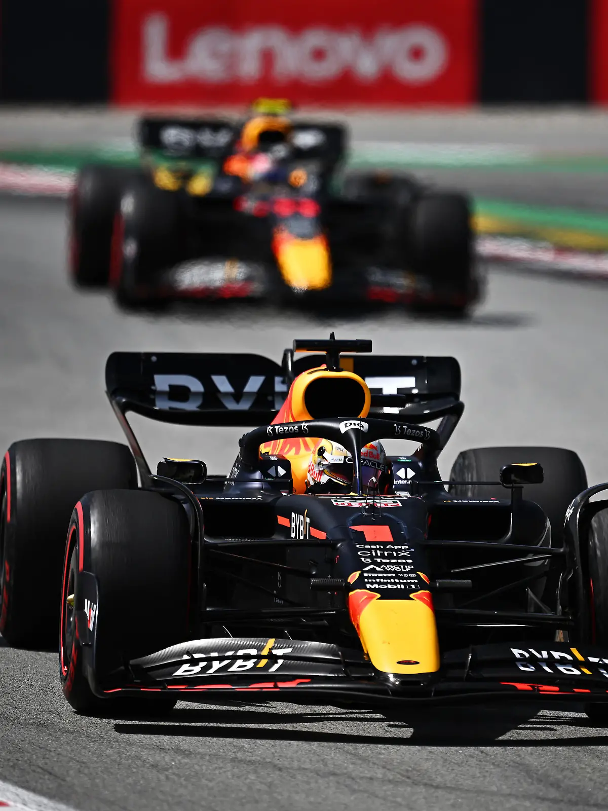BARCELONA, SPAIN - MAY 22: Max Verstappen of the Netherlands driving the (1) Oracle Red Bull Racing RB18 leads Sergio Perez of Mexico driving the (11) Oracle Red Bull Racing RB18 during the F1 Grand Prix of Spain at Circuit de Barcelona-Catalunya on May 22, 2022 in Barcelona, Spain. (Photo by Clive Mason/Getty Images)