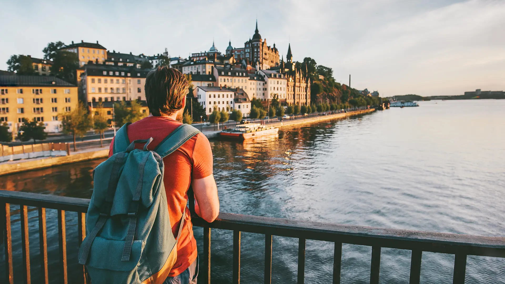 Tourist man sightseeing Stockholm city enjoying view traveling lifestyle summer vacations in Sweden