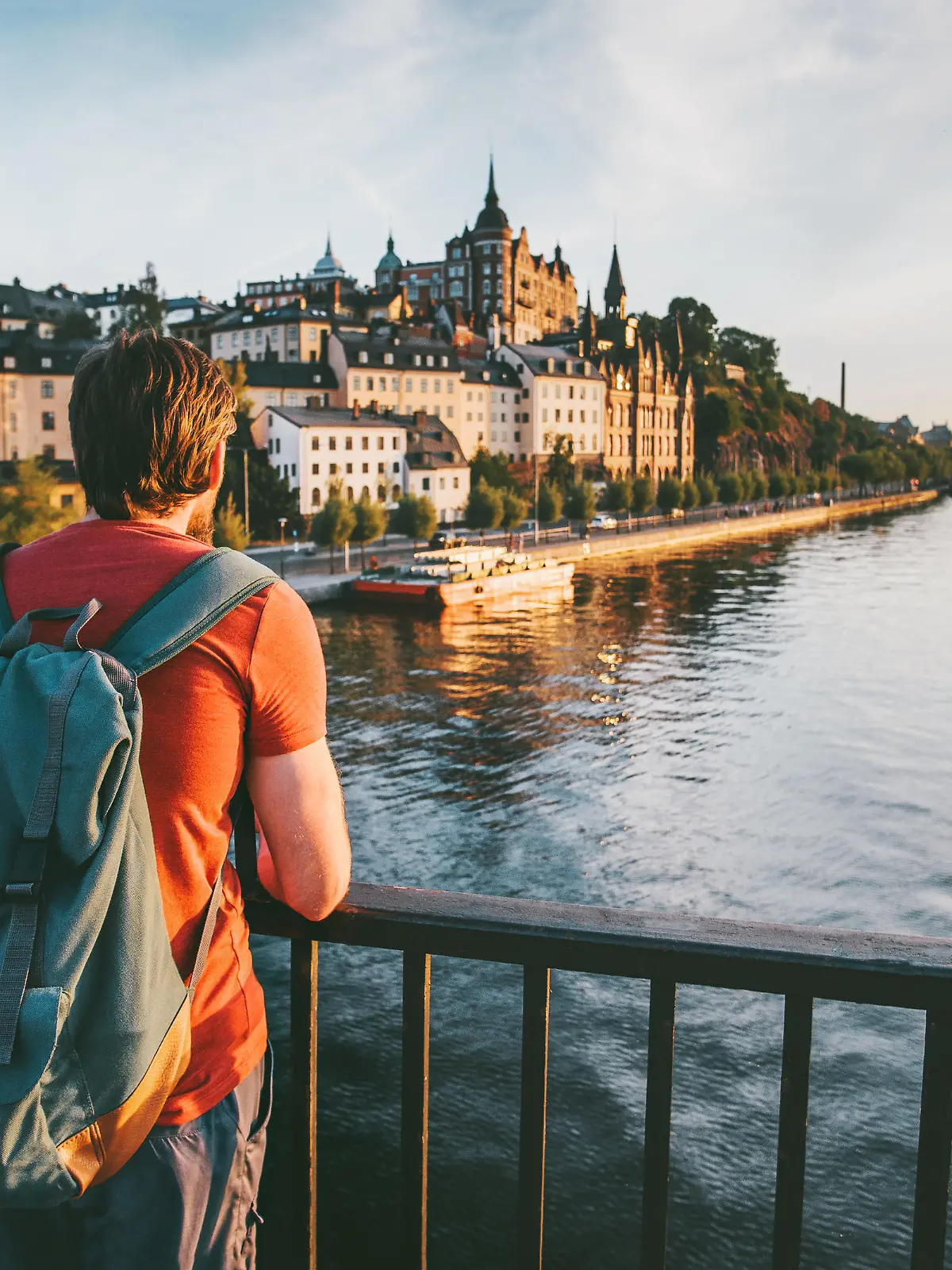 Tourist man sightseeing Stockholm city enjoying view traveling lifestyle summer vacations in Sweden