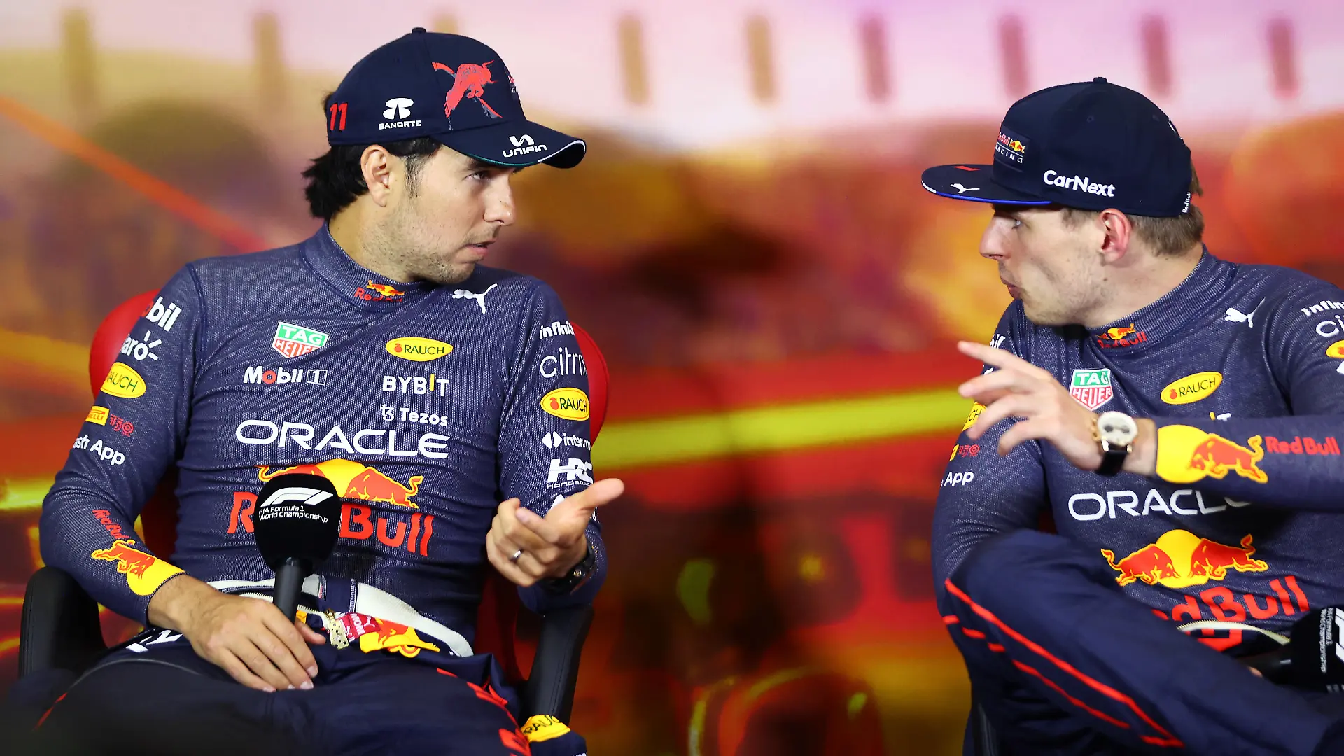 BARCELONA, SPAIN - MAY 22: Race winner Max Verstappen of the Netherlands and Oracle Red Bull Racing and Second placed Sergio Perez of Mexico and Oracle Red Bull Racing talk in the press conference after the F1 Grand Prix of Spain at Circuit de Barcelona-Catalunya on May 22, 2022 in Barcelona, Spain. (Photo by Dan Istitene/Getty Images)